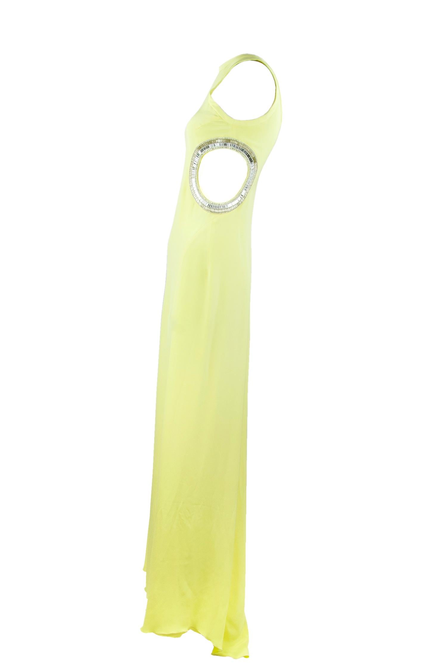 Shine at your next black tie event in this exquisite light yellow Pucci gown.  Incredibly elegant and sexy, this gown features cutouts and crystal embellishments.  Made out of a luxurious light yellow silk.  

Size: IT 40

Condition: Pristine, like