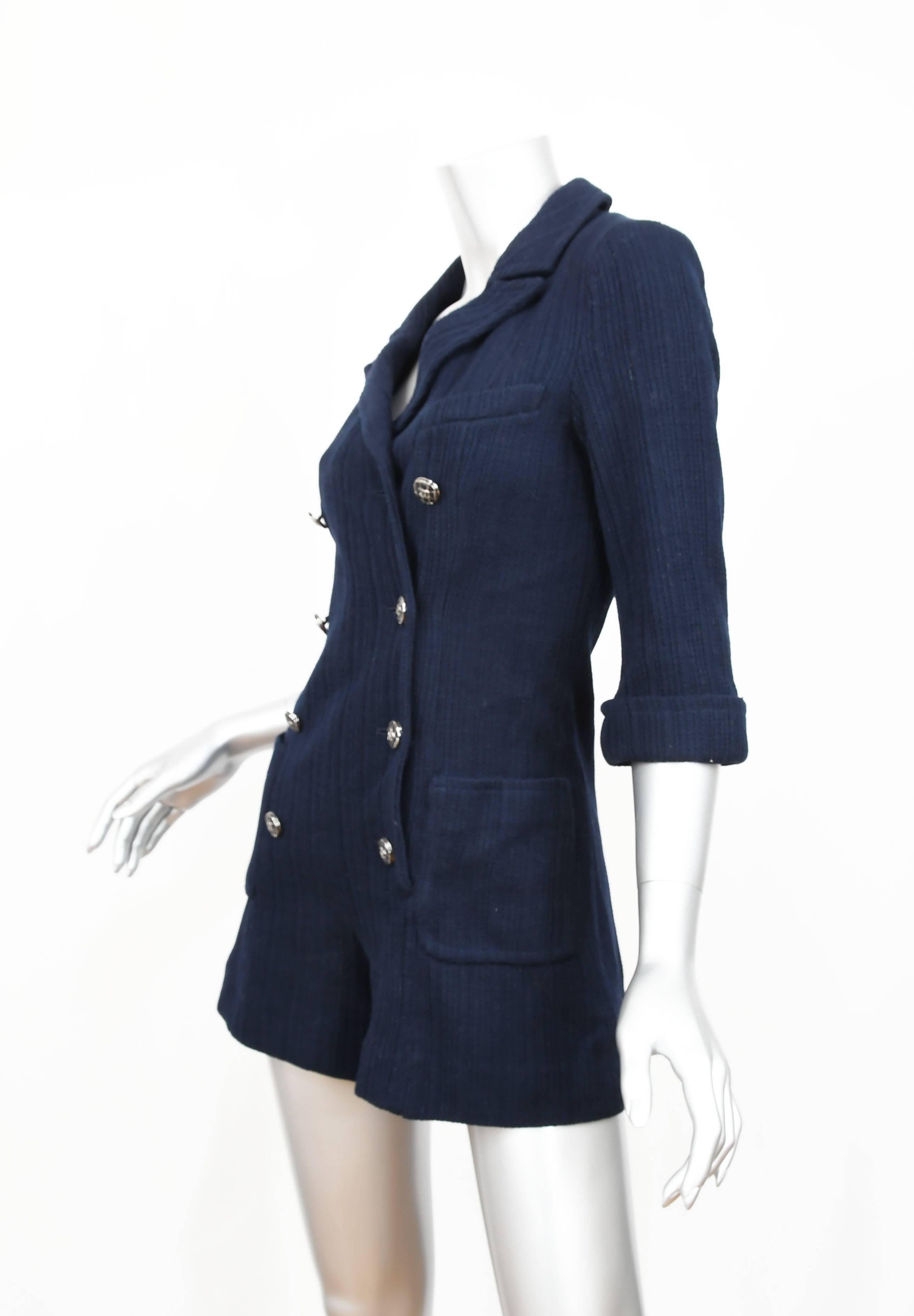 Chanel Navy cotton chic double breasted romper with 3/4 length sleeves.  This one-piece romper is ideal for Resort or Spring/Summer.  It is equally exciting to wear on the beach or having lunch at poolside.  The look is sophisticated with notched