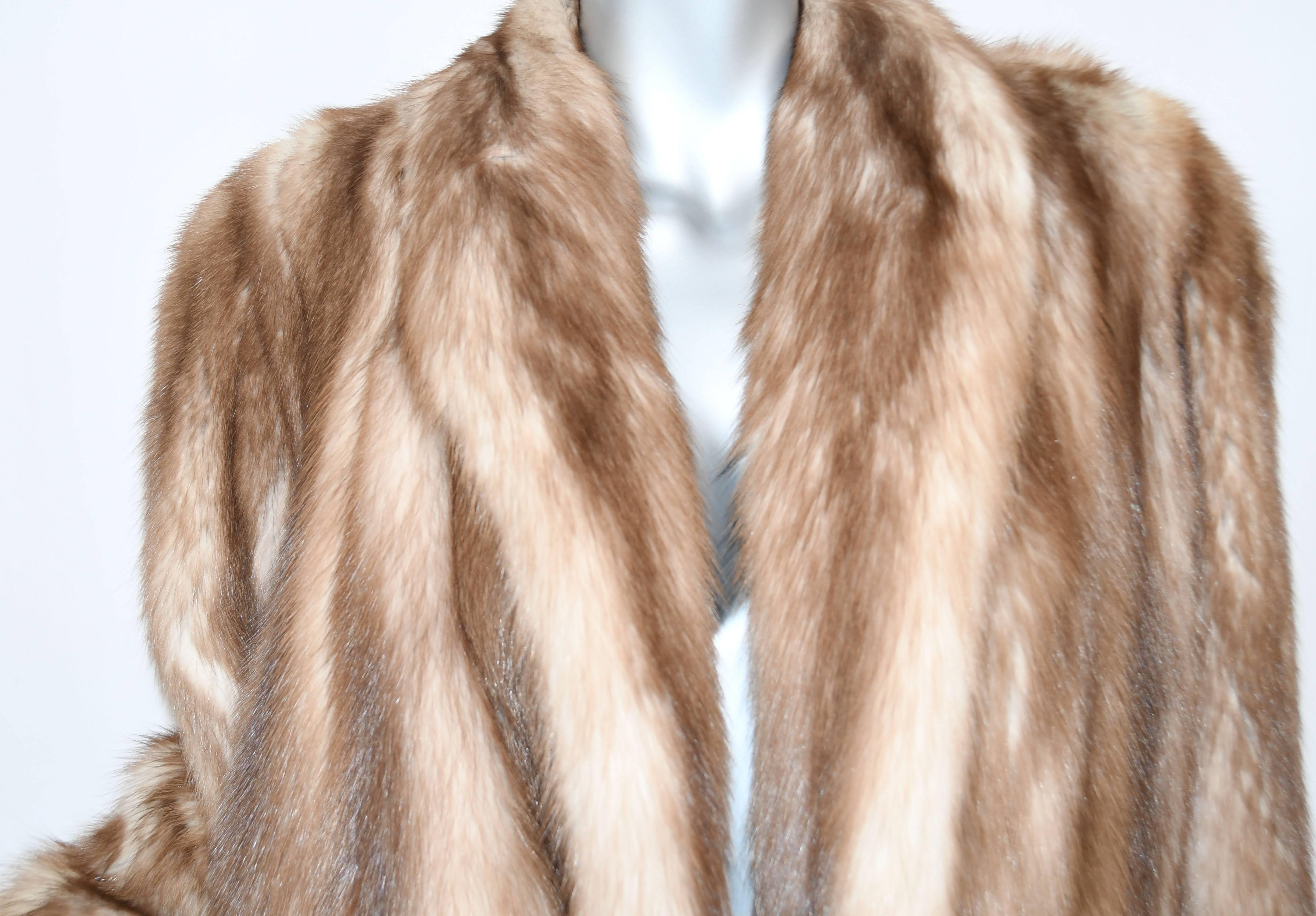 Refined and classic luxurious Stone Marten Fur long jacket.  Full shawl collar with long sleeves lined in silk.  Make a statement of elegance in a jacket that will be the star of every occasion.  Pockets lined in velvet. No size tag but fits XS/S.
