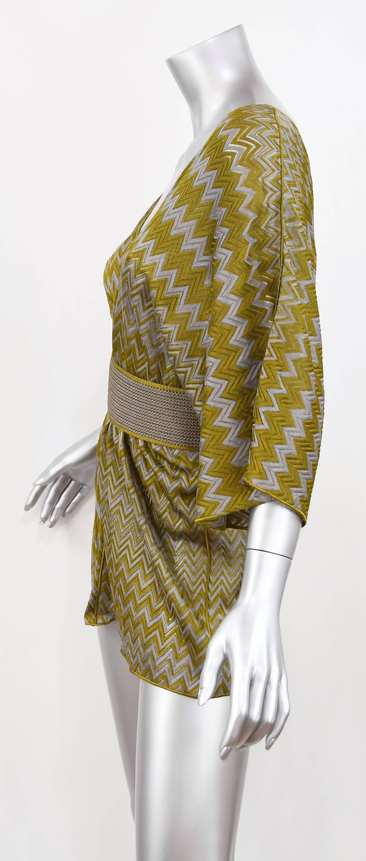 This vacation/resort essential Missoni Zigzag Knit Tunic is crease proof and will take up minimal space in your luggage.  Wear over a swimsuit or leggings for a chic look.  It has Dolman sleeves and includes a matching belt to cinch the waist.  One