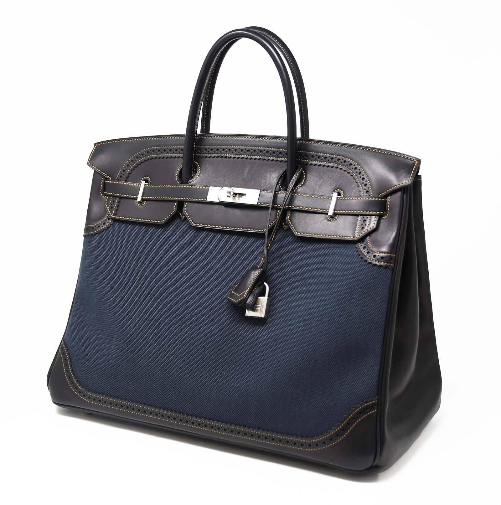 Extremely coveted Ghillies Birkin bag, new with plastic on the hardware.  The swift leather is dark brown and the rest a denim toile.  The hardware is palladium.  On the inside there are two large leather pockets on each side, one open and the other