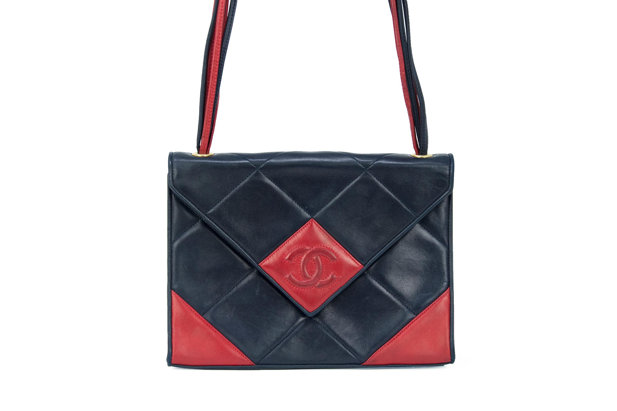 Extremely rare black & red Chanel vintage bag with an interesting geometric design.  Shoulder strap made out of multi-strands of black and red leather.  CC logo sewn into front with magnetic closure.

Condition: Excellent vintage