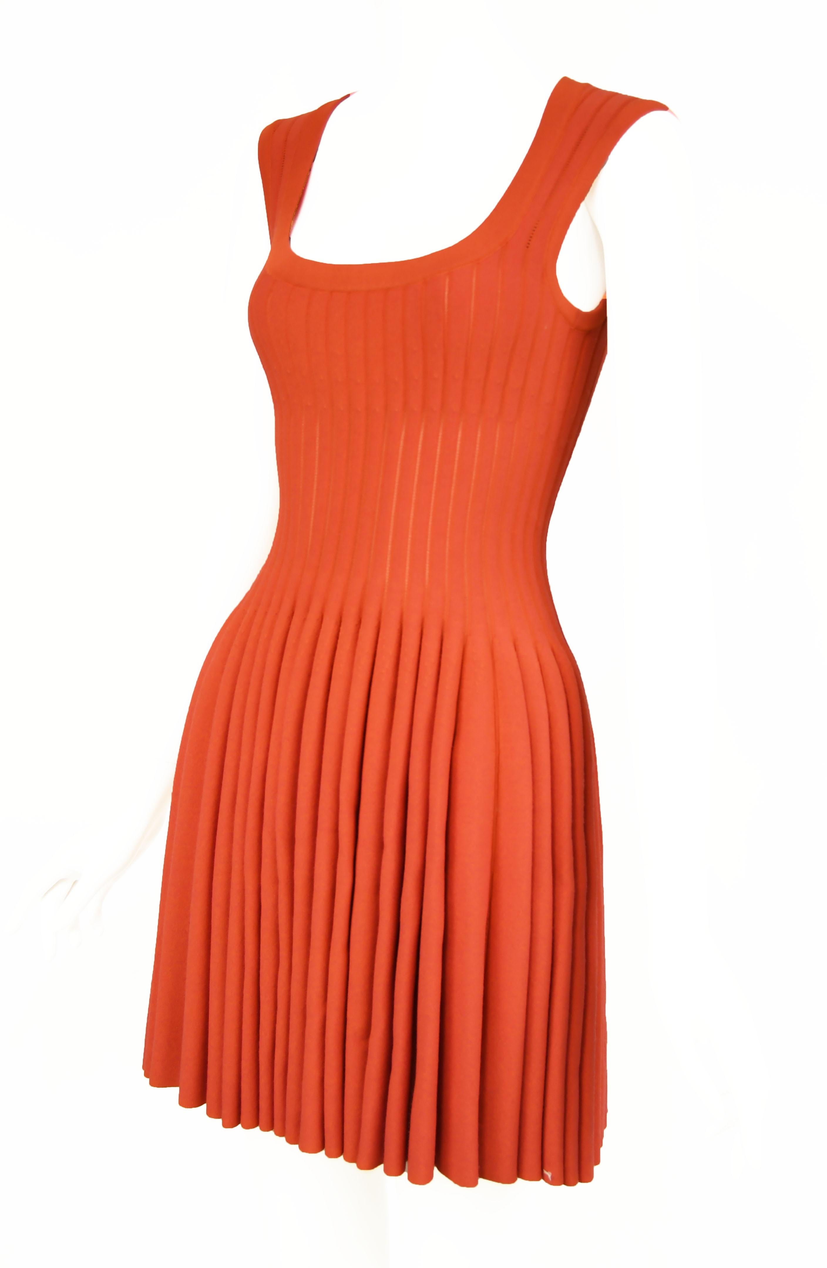 Gorgeous dark coral Alaia fit and flare dress.  Slightly sheer knit between the ribs (see last photo) gives this dress interesting detail and texture.  Beautiful square neckline, classic Alaia dress in stunning color.

Size: FR 38

Condition: