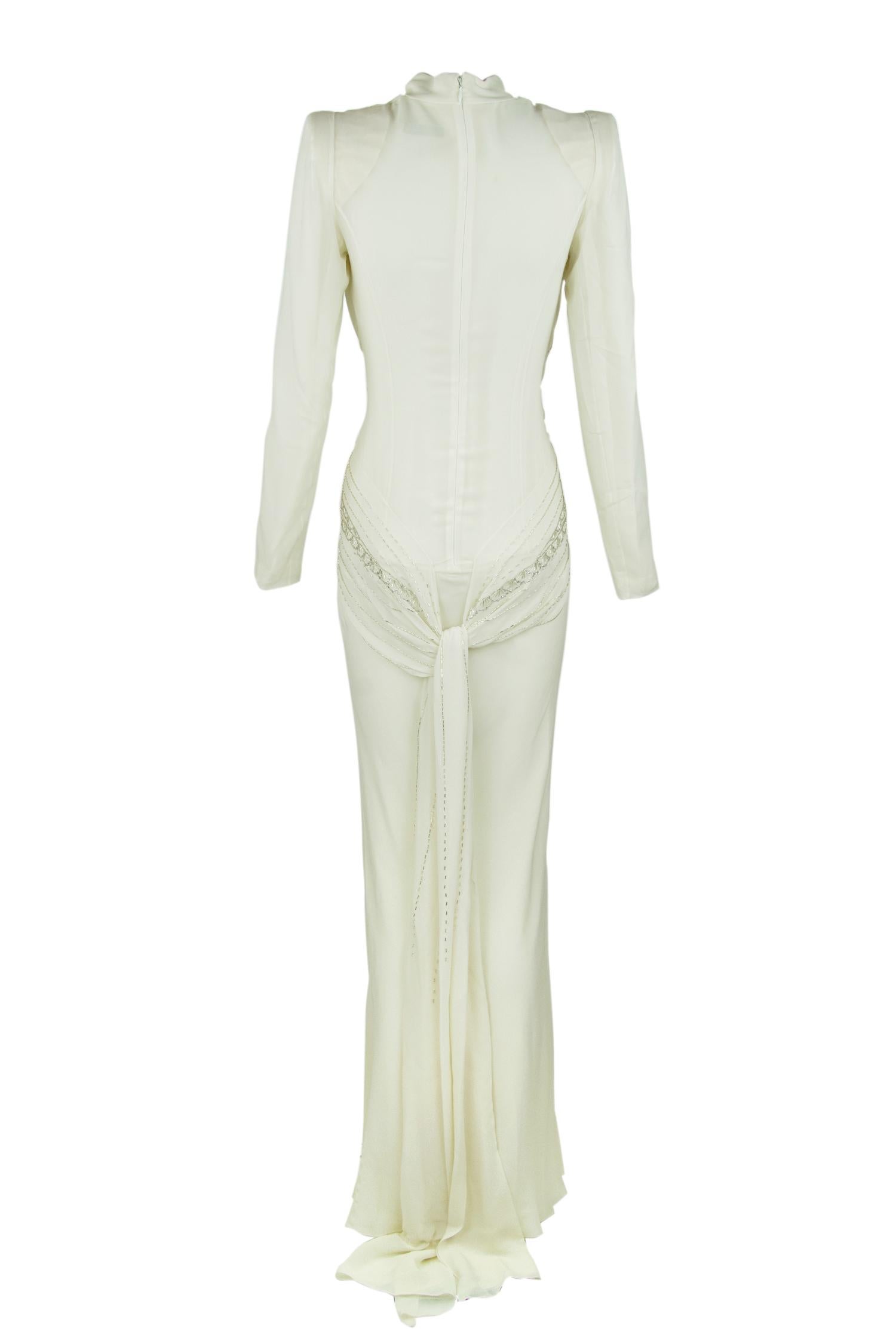 Incredible white silk vintage Dior gown that embodies everything about the House of Dior.  Shoulder pads give this gown a vintage feel with an incredibly low, sexy v neck.  The bodice is embroidered in silver beading.  This is a rare find.

Size: