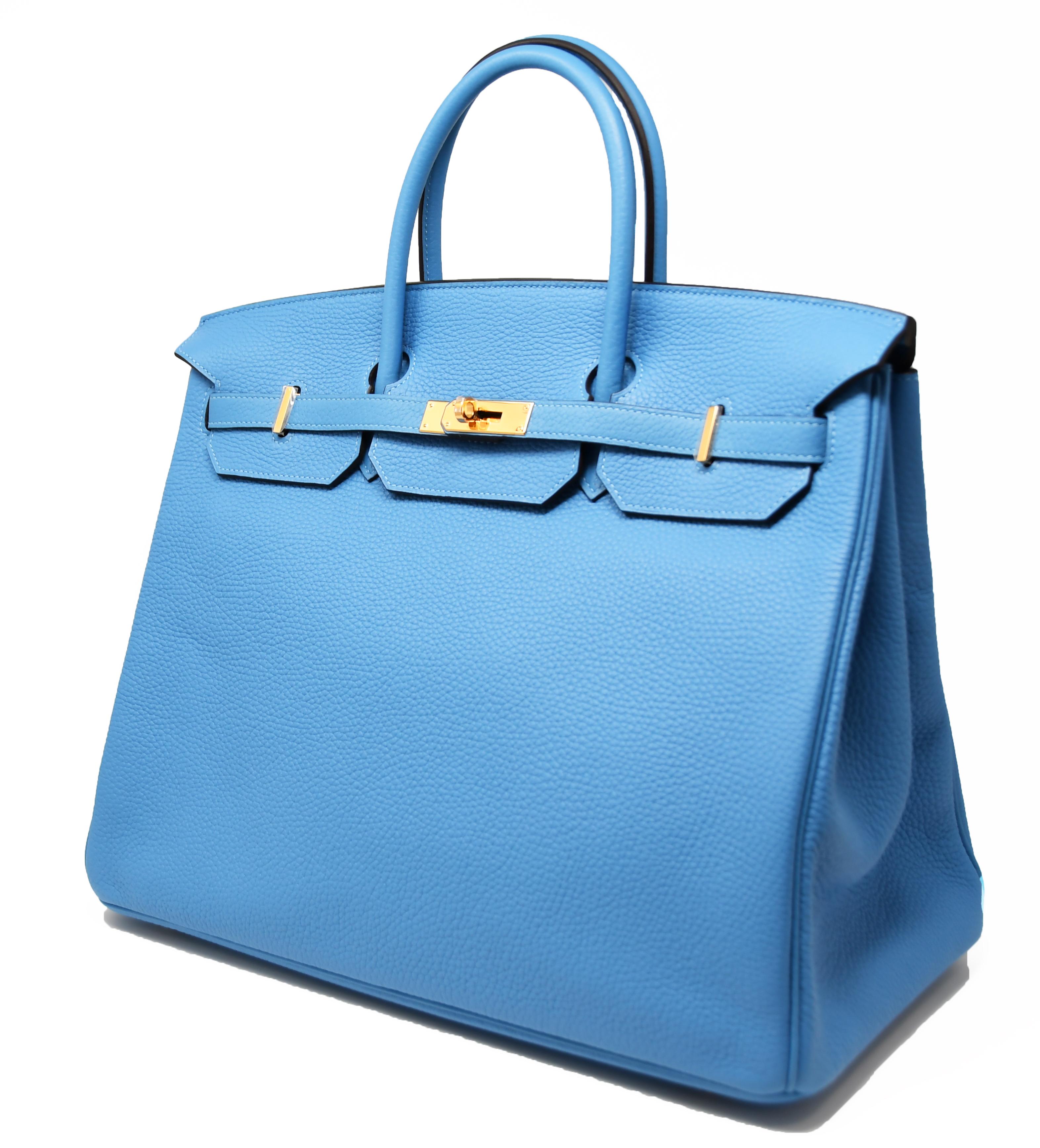 This stunning blue paradise color is perfect for spring and summer.  A brand new item, with the plastic still on the hardware, this bag comes with the dust cover and box.

Size: 40cm

Condition: New with plastic on the hardware, never used