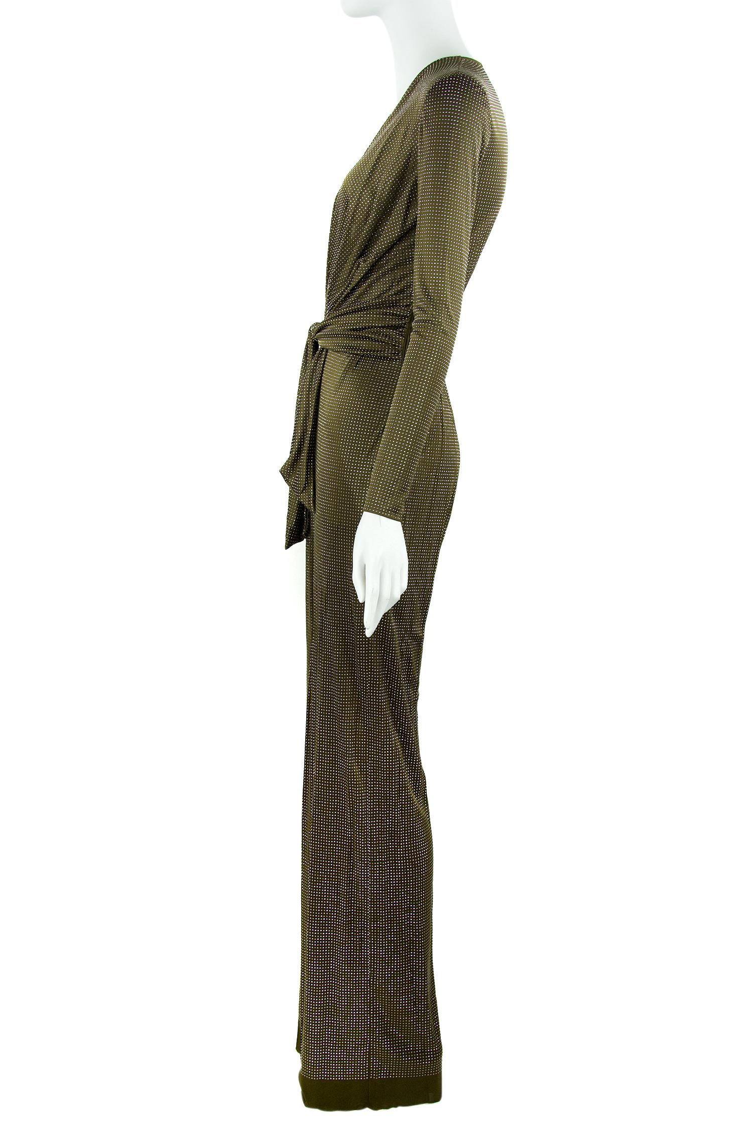 Incredible Emilio Pucci stretch knit jumpsuit that brings back a taste of the 70s.  Features a plunging v neck with a gathered waist and silver beaded brown fabric. Additionally, there are delicate covered buttons on the sleeves. Such a fun look for