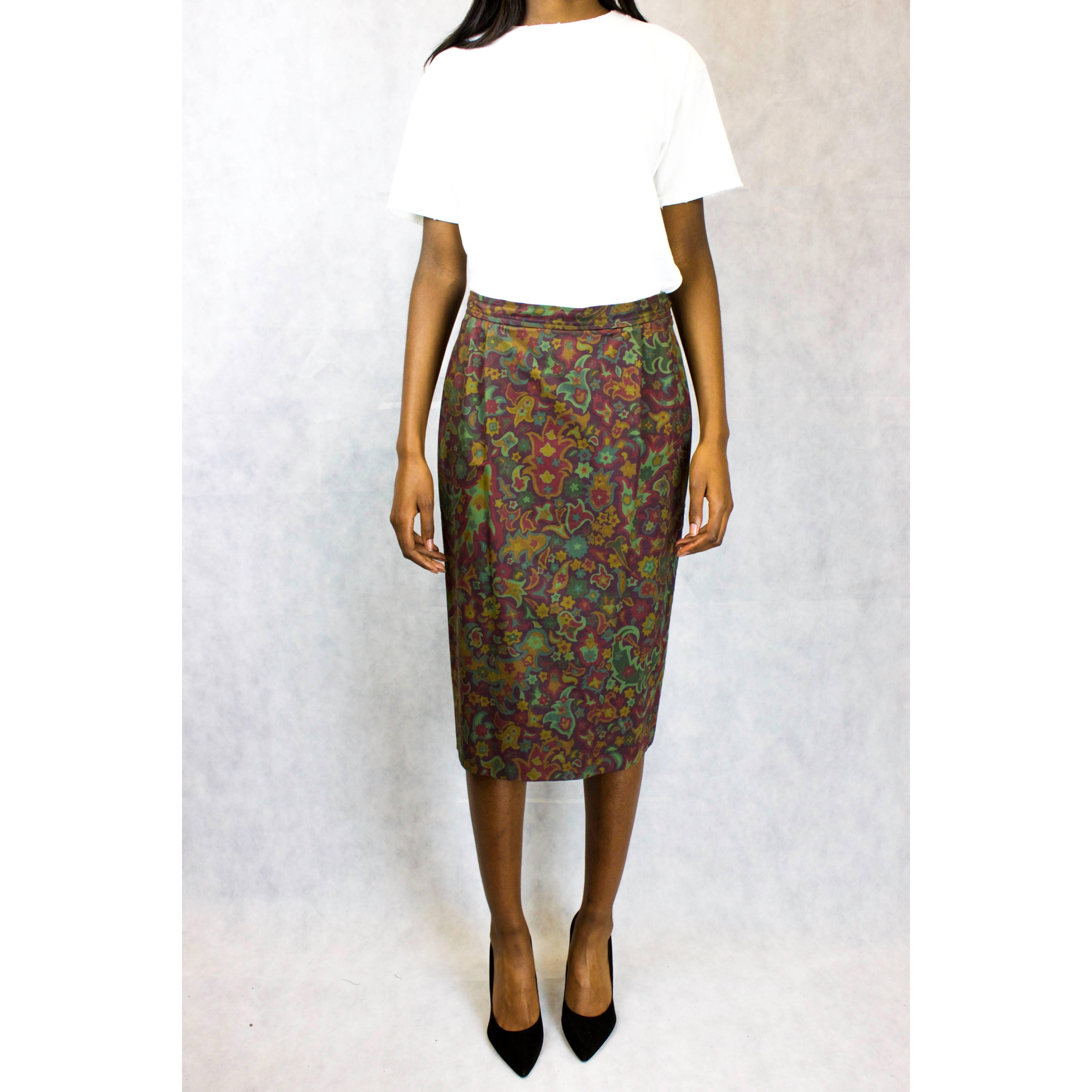 Recognised under the Saint Laurent Rive Gauche label, this straight line “peg-leg” pencil skirt was designed and made circa late 1970. Constructed from cotton with a luxurious wax finish, the skirt has a camouflage inspired paisley print giving the