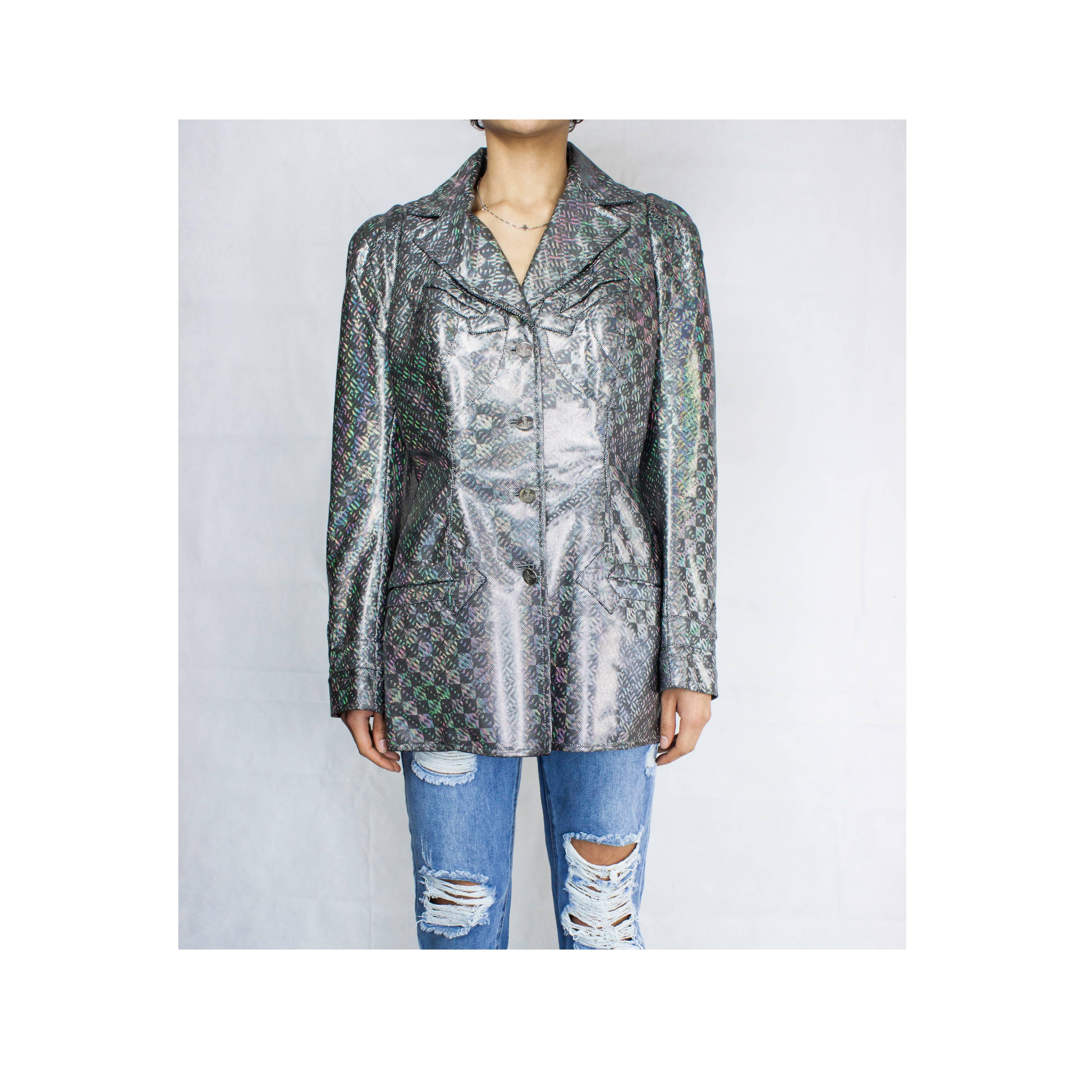 
Westwood has designed clothes outrageously flamboyant. They are beautiful, and often unconventional.

This jacket echoes early twentieth century military wear. It shows the designer’s innovative take on traditional tailoring and use of