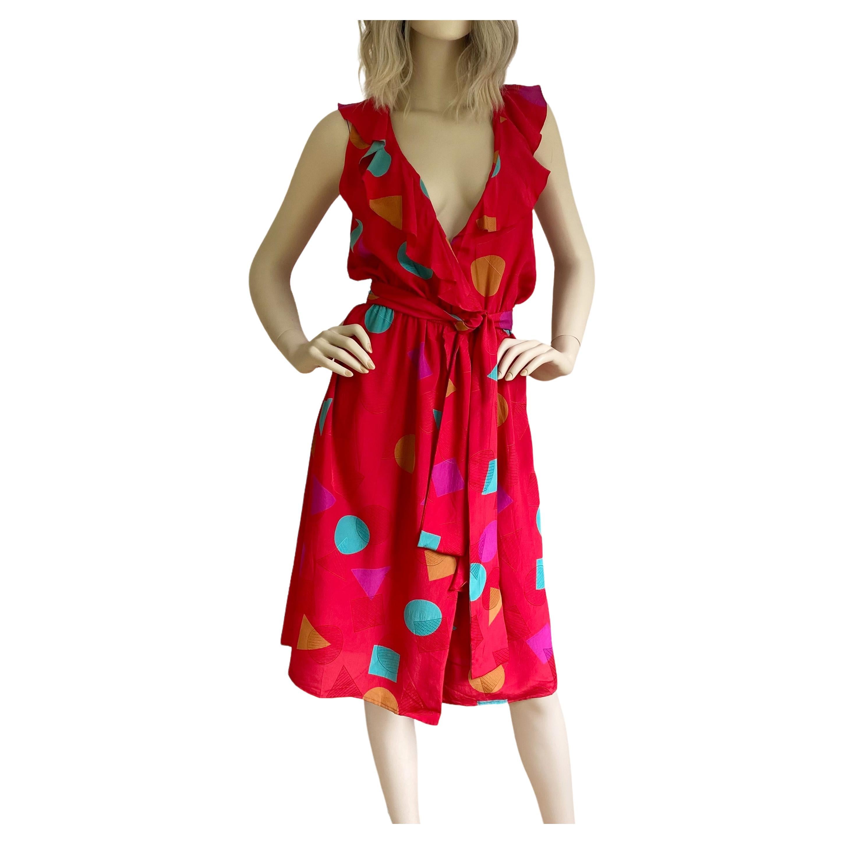 Flowy flirty red silk wrap (mock wrap) dress.
Bias-cut ruffles.
Elastic waist. With detachable self belt.
Flora's geo print on geo silk jacquard. 
Size 8
25