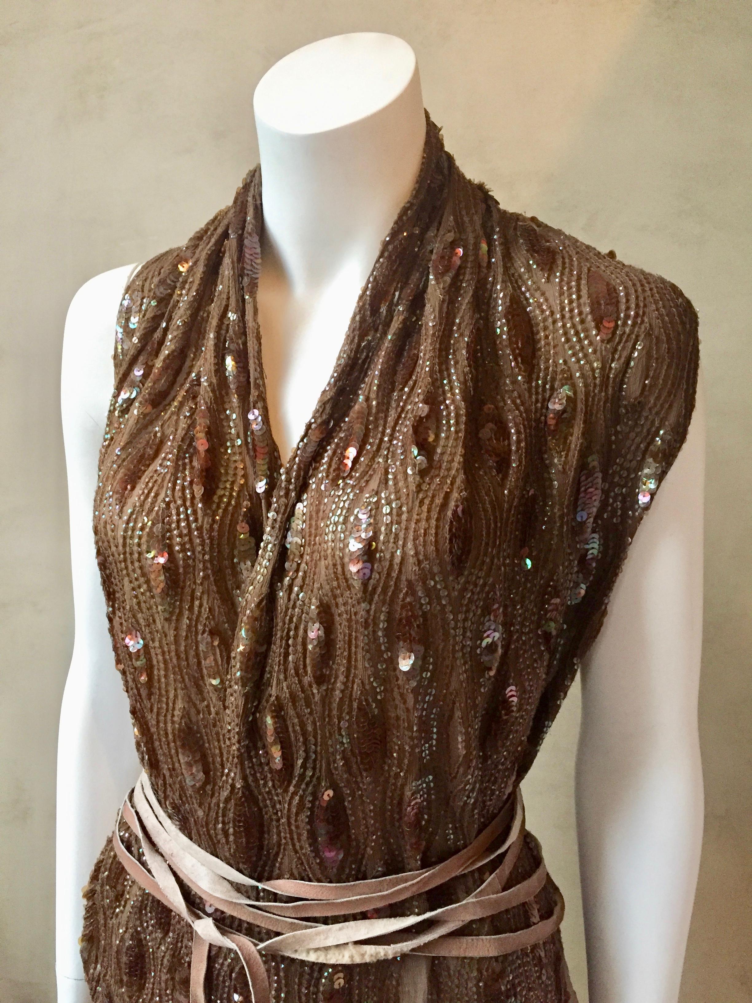 Ann Demeulemeester Taupe brown silk chiffon wrap top/vest embroidered with opalescent taupe sequins and wrapped with a leather belt.  The front is asymmetrical and can be worn open or closed and wrapped around multiple times with the very long thin