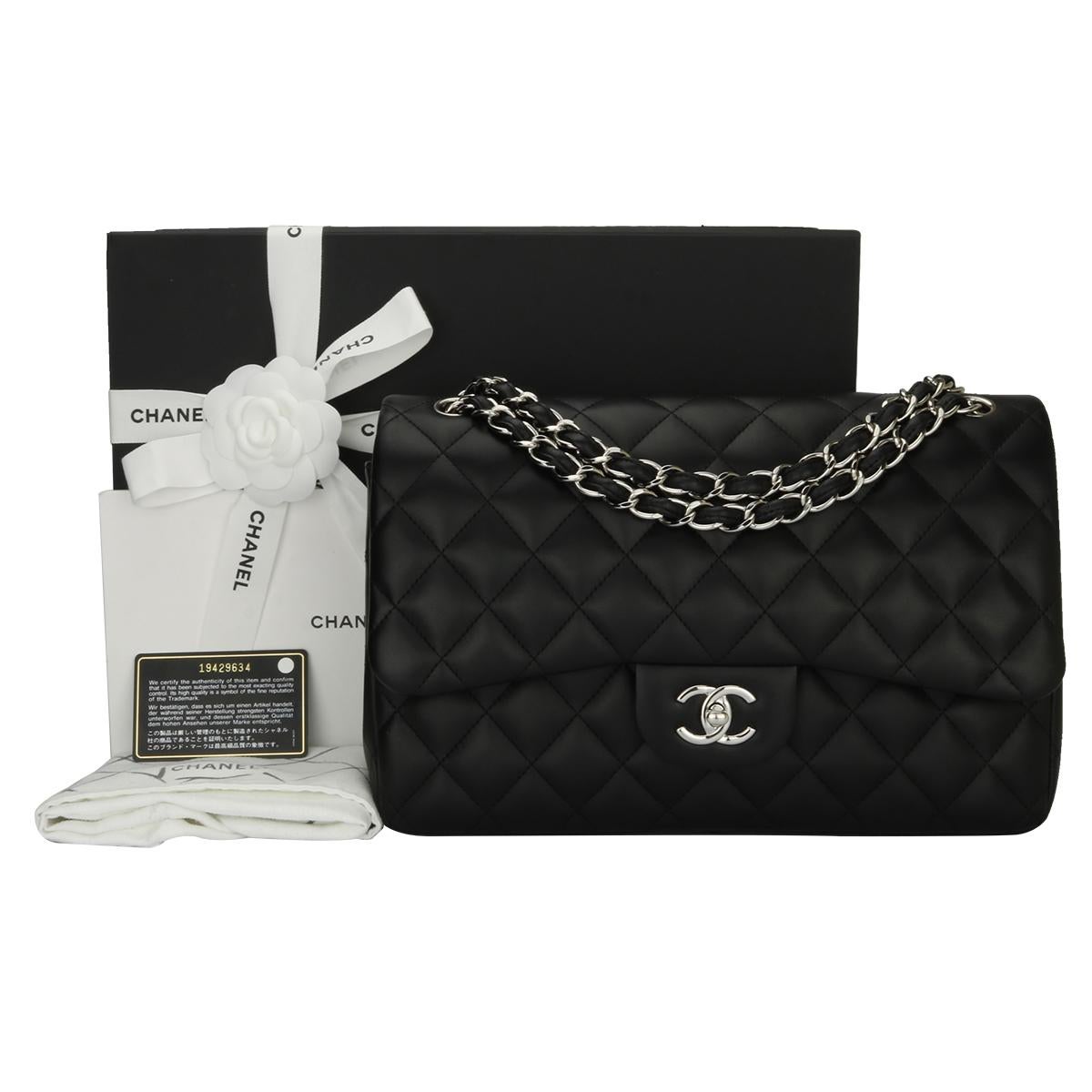 Authentic CHANEL Classic Jumbo Double Flap Black Lambskin with Silver Hardware 2014.

This stunning bag is in a mint condition, the bag still holds its original shape, and the hardware is still very shiny. Leather smells fresh as if new.

Exterior