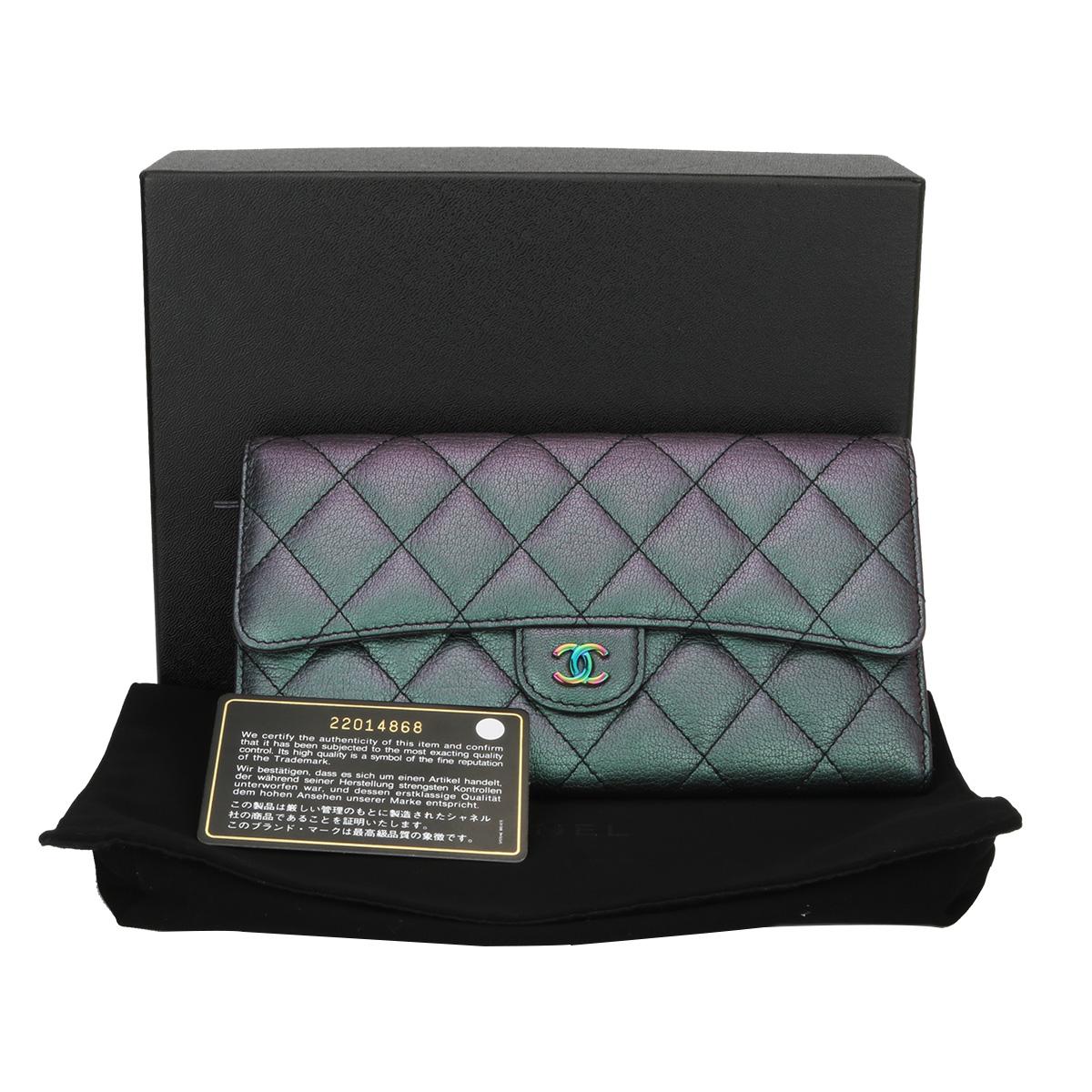 Authentic CHANEL Purple Iridescent Goatskin Flap Wallet with Rainbow Hardware 2016 LIMITED EDITION.

This stunning flap wallet is in a mint condition, it still holds its original shape, and the hardware is still very shiny. Leather smells fresh as