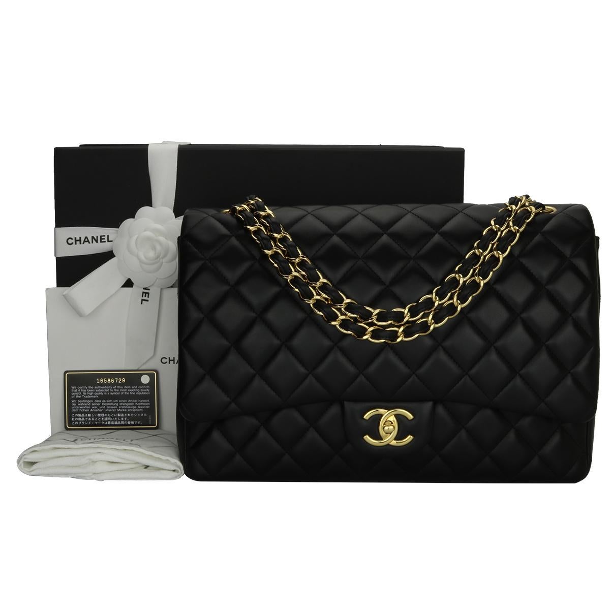 Authentic CHANEL Black Lambskin Maxi Double Flap with Gold Hardware 2012.

This stunning bag is in a pristine condition, the bag still holds its original shape and the hardware is still very shiny. Leather still smells fresh as if new.

Exterior