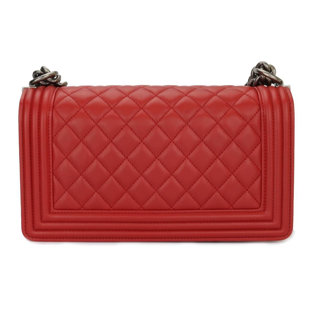 Authentic Chanel Old Medium Boy True Red Calfskin with Ruthenium Hardware 2015

This stunning bag is still in a mint condition, the bag still holds its original shape and the hardware is still very clean and shiny.

Exterior Condition: Mint