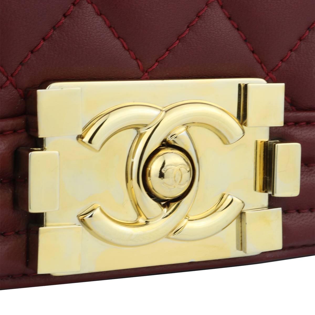 Authentic CHANEL Old Medium Quilted Boy Burgundy Lambskin with Shiny Gold Hardware 2015.

This stunning bag is still in a mint condition, the bag still holds its original shape and the hardware is still very clean and shiny.

Exterior Condition: