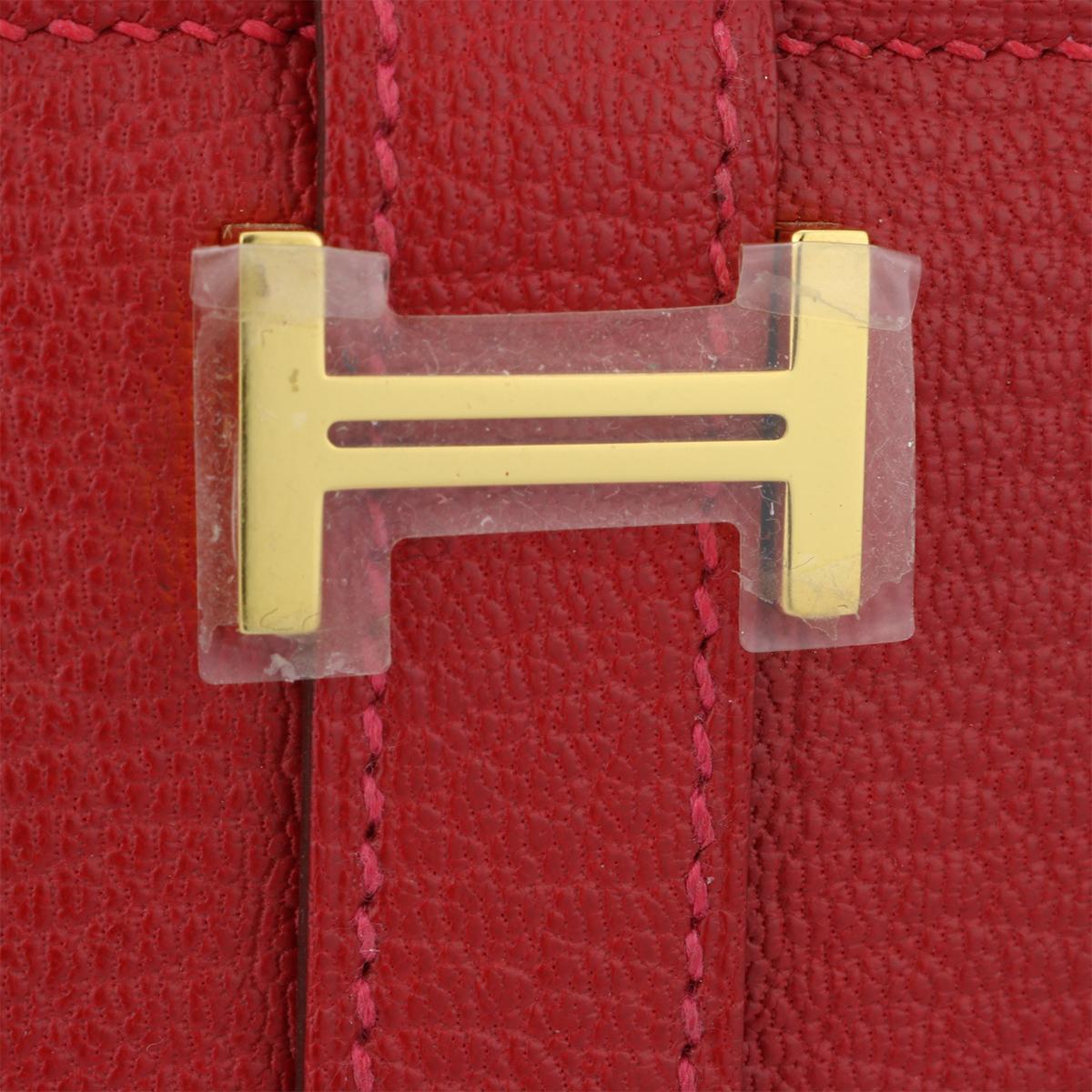Authentic Hermès Bearn Wallet Q5 Rouge Casaque Goatskin with Gold Hardware Stamp Q 2013.

This stunning Bearn wallet is in pristine-brand new condition, the wallet still holds its original shape, and the hardware is still very shiny.

Exterior