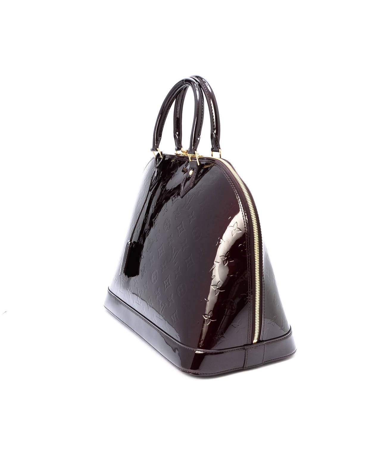 Amarante Vernis leather 
Due to its vintage nature, there are minor scratches on the leather trims around the bottom of the bag 
Comes with original clochette, keys, lock and dust bag 
The measurements of the items are 38 cm by 28 cm by 18 cm,