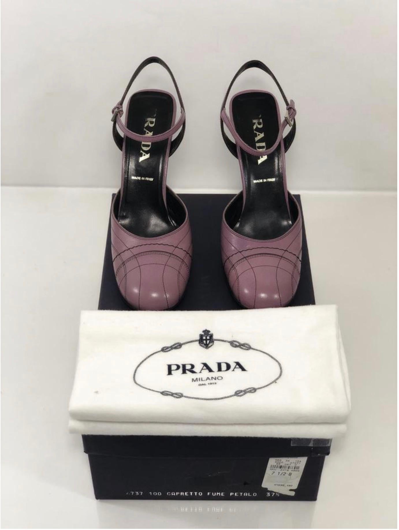 MODEL - Prada Capretto Fume Petalo Decorative Stitch Mary Jane Pump with Chunky Flair Heel

CONDITION - Exceptional! Very light wear on outer soles. 

SKU - AIS

ORIGINAL RETAIL PRICE - 400 + tax

SIZE - Euro - 37.5 US - 7.5M

MATERIAL - Leather