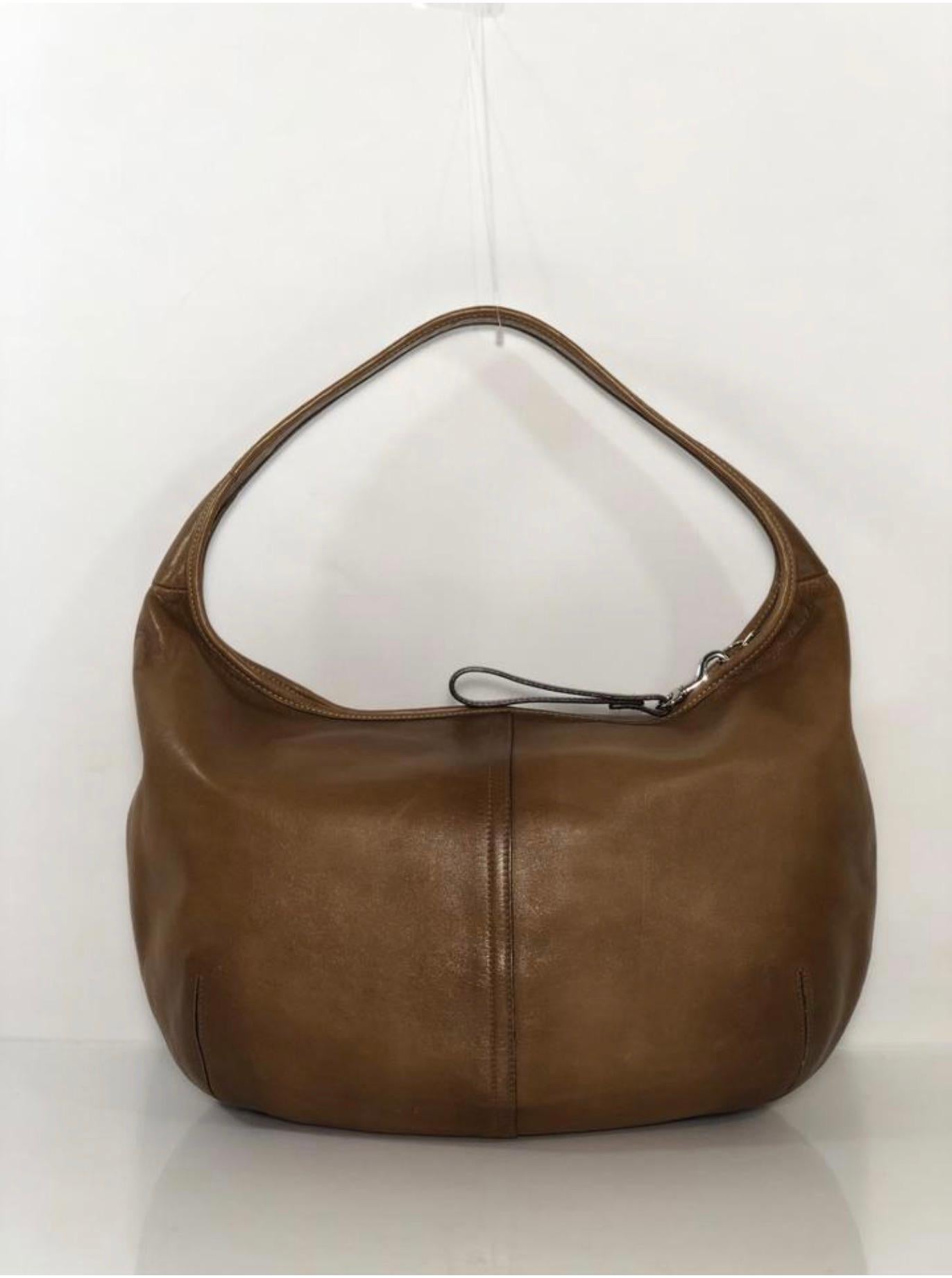 MODEL - Coach Vintage Ergo Leather Hobo in Brown

CONDITION - Exceptional! No signs of wear.

SKU - AIS-KUTA-6

ORIGINAL/CURRENT RETAIL PRICE - 395 + tax

DATE/SERIAL CODE - D3K-9227

DIMENSIONS - L12 x H10 x D3

STRAP/HANDLE DROP - 7

MATERIAL -