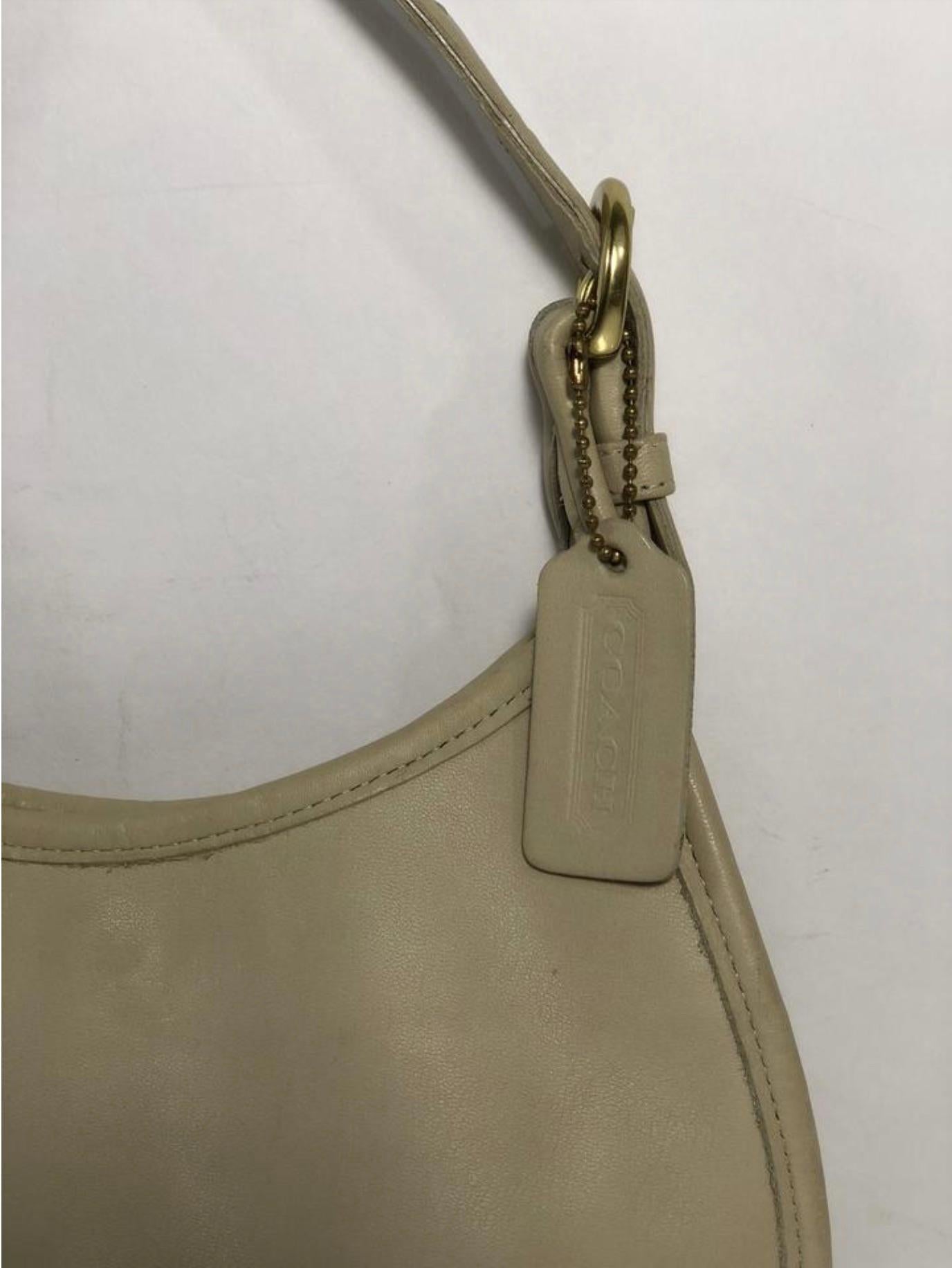 MODEL - Coach Vintage Mini Soho Shoulder Handbag

CONDITION - Exceptional! No signs of wear.

SKU - AIS-WOFS-8

ORIGINAL/CURRENT RETAIL PRICE - 195 + tax

DATE/SERIAL CODE - B8C-4106

DIMENSIONS - L9 x H7 x D2

STRAP/HANDLE DROP - 3.5 to