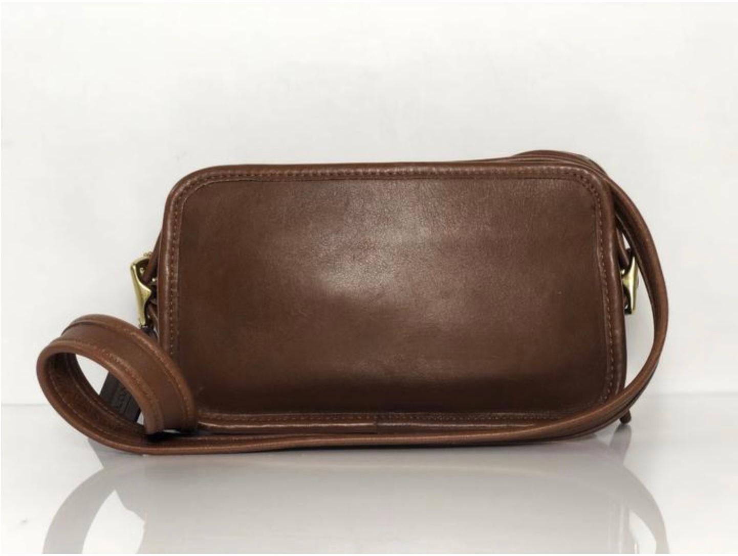 MODEL - Coach Vintage Small Zipper Crossbody Shoulder Handbag in Brown

CONDITION - Exceptional! Very very light scuffing.

SKU - AIS-MARS-8

ORIGINAL/CURRENT RETAIL PRICE - 275 + tax

DATE/SERIAL CODE - NA

DIMENSIONS - L8 x H5 x D2.5

STRAP/HANDLE