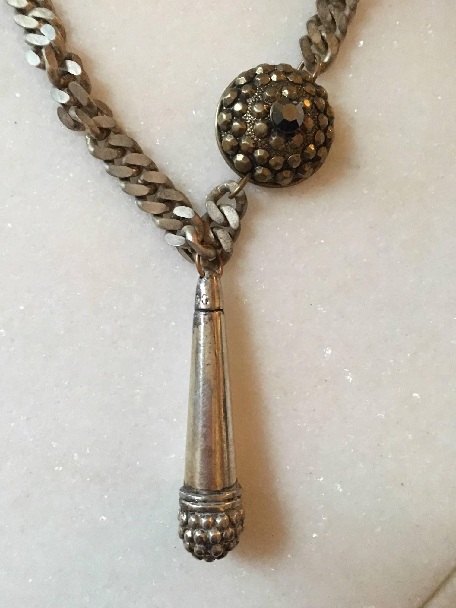 JEAN PAUL GAULTIER  a large  vintage   ethnic inspired silver plated  with patina necklace Chaine with  a circular and a tubular form  of  bead pattern design pendent .
Embossed JPG.
Indicative measurements :
 full  length approx. 52 cm (20 inches)