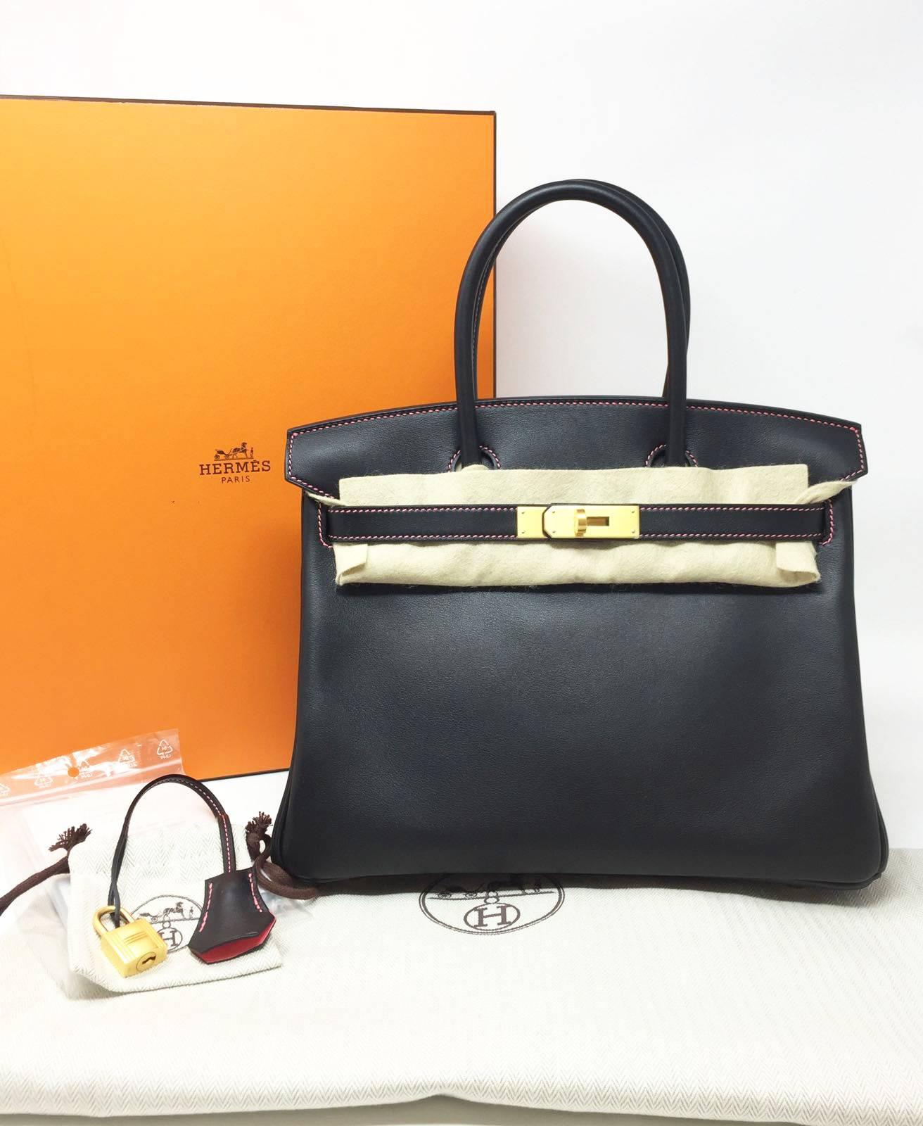 Hermes Paris Sac Birkin 30 Veau Swift Black, inside chevre rose azalee color. 
 Special Order Exclusive horseshoe stamp. Hdw Gold. Never used. Brand new canned, year 2018. Original Envoice. 
Pristine conditions (with plastic on the hardware) Perfect