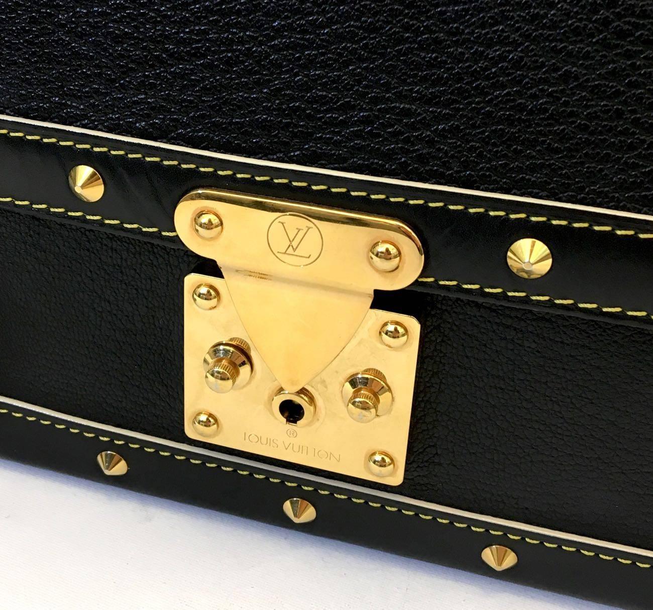 Louis Vuitton Limited Edition Bag 2003 
Suhali Le Talentueux Handbag Leather
Gold tone corner plates, stud detailing
Crafted from black suhali leather
Stand-out yellow contrast stitching, and gold-tone hardware accents.
Fabbric lined interior.
Good