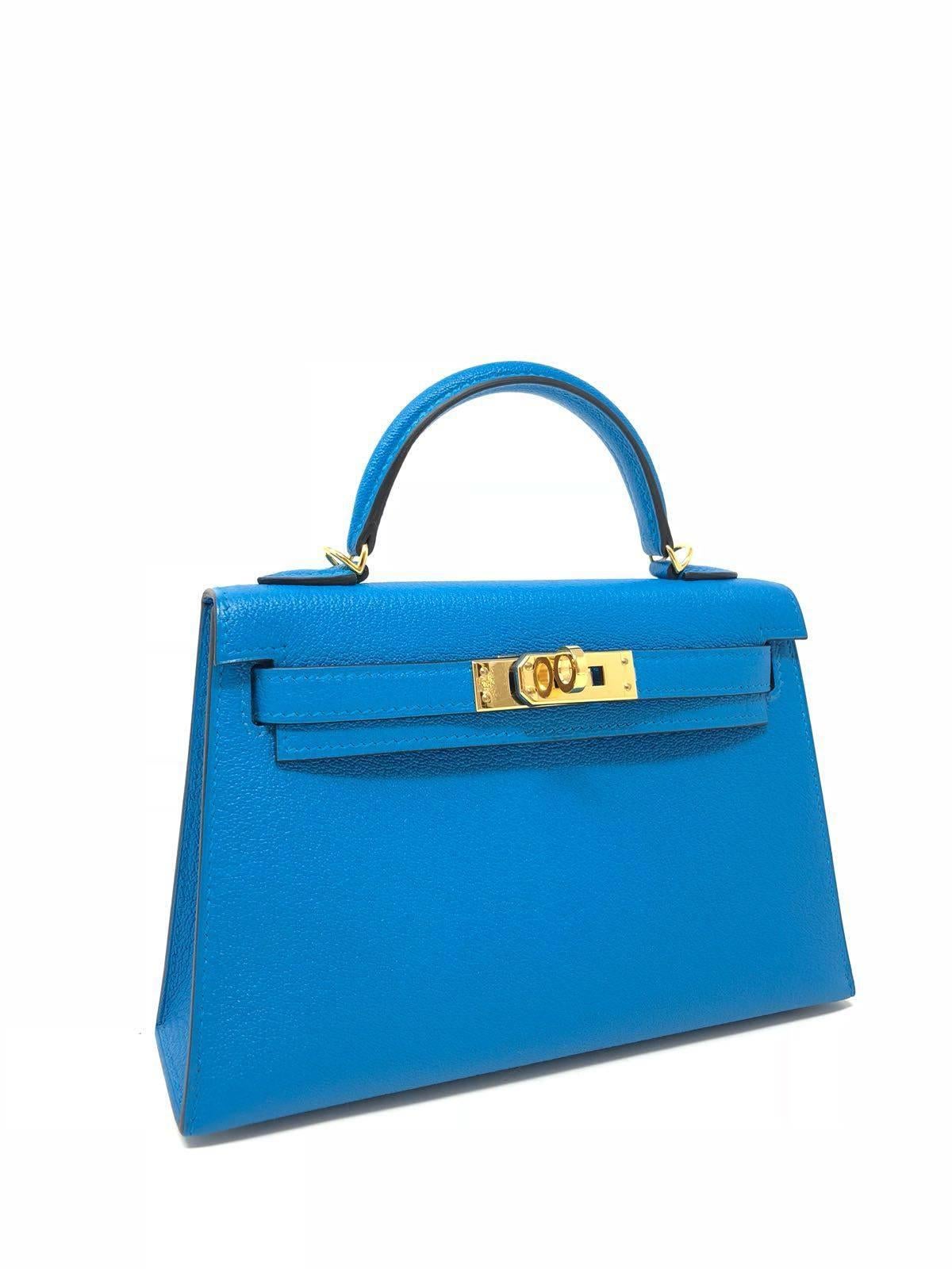 Hermes Kelly Bag 20 Mini Kelly II Blue Zanzibar Chevre Leather. This jewel tone is accentuated with gold hardware.  Very nice size. Comes with signature hermes box, shoulder strap and original anvoice . New Condition, never used. 
Dimensions 20.0 x