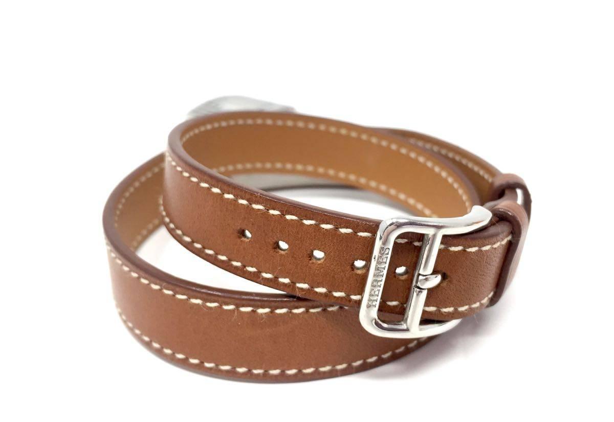 Hermes Watch Kelly Natural Barenia Calfskin Leather Double Strap Watches, Year 2003 ( G in a square ) 
quartz movement. Hdw Silver, very good condition. Dust bag included. 
- Watch Specifications: Face size: 1.6 x 1cm Case: 2 x 2.1cm Wrist Size: 37