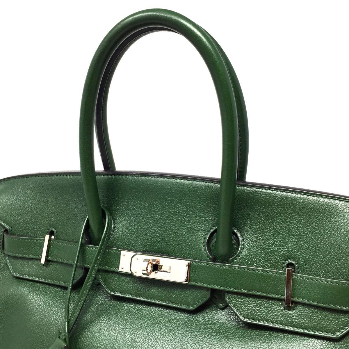 Hermes Birkin 35 in Green olive veau graine leather. Palladium hardware and in excellent condition. Beautiful dark green that will add a pop of color to any wardrobe.  Stamped O square from 2011. Dust-bag, clochette loco key and protege pluie