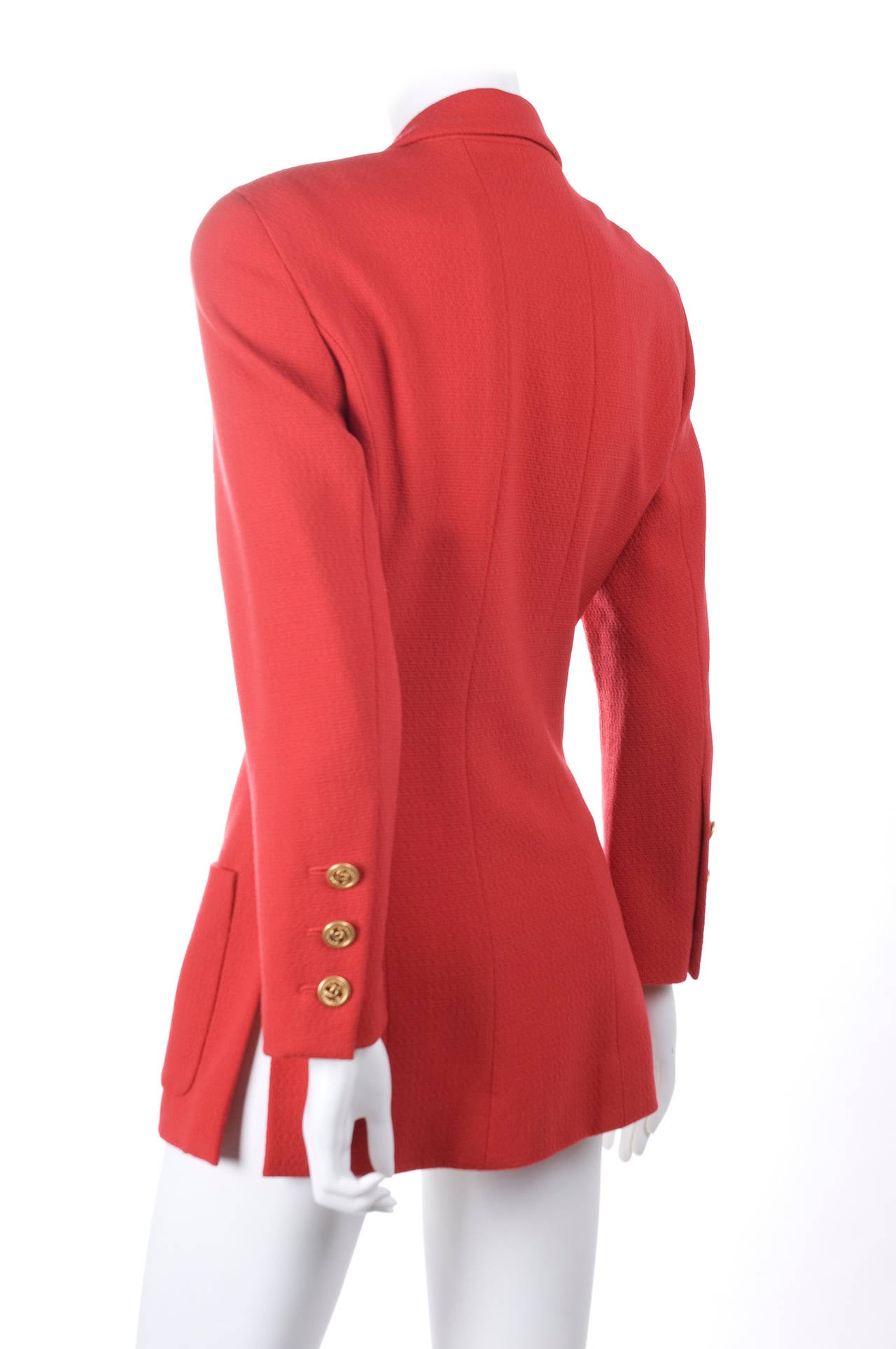 Vintage 1980 Chanel Jacket in Lipstick Red and Gold Buttons.
Excellent condition - no flaws to mention.
Size 38 EU

Measurements:
Length 73.5 cm - 29