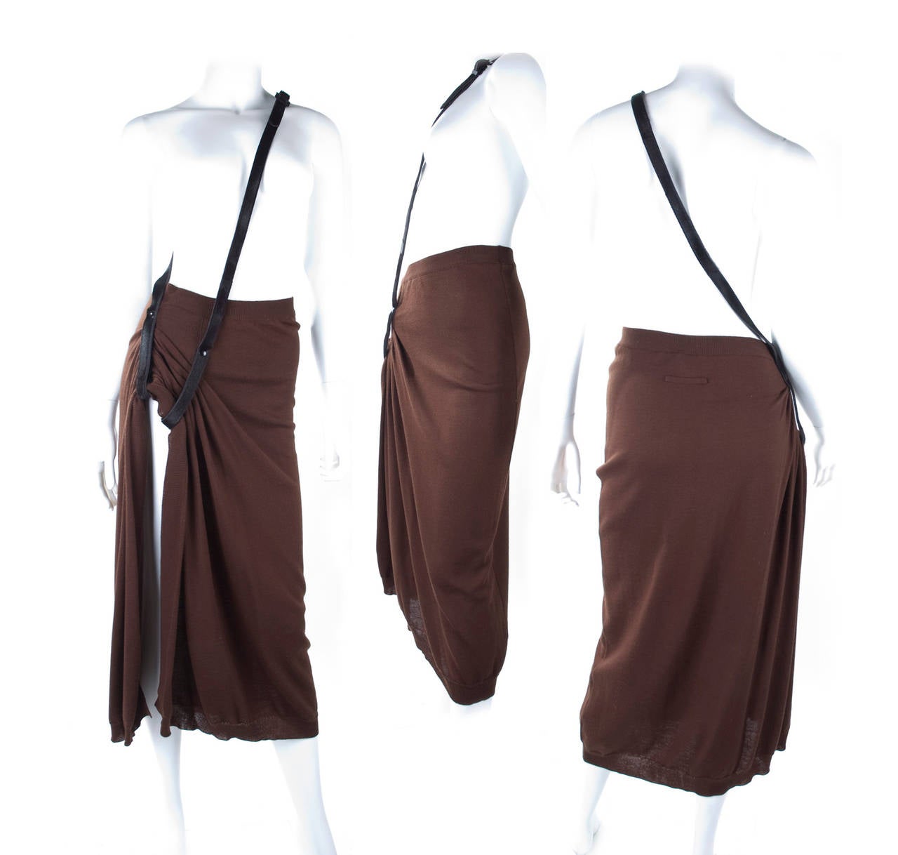 Jean Paul Gaultier Malle Knit Skirt with Leather Shoulder Strap.
Size : L
Material is virgin wool and strap calf-leather.
Measurement:
Length 86 cm -  34