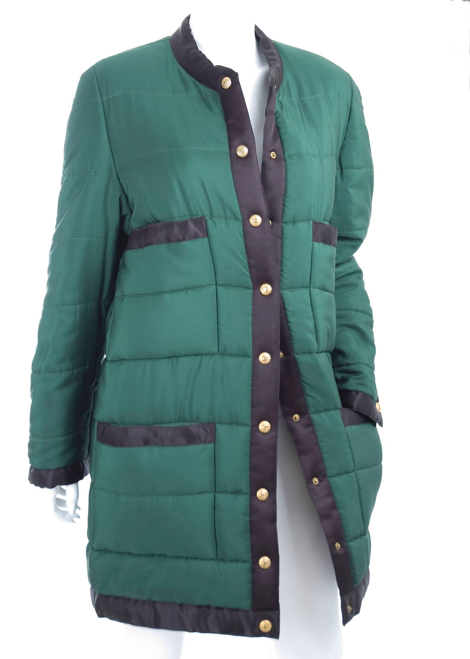 Vintage Chanel Quilted Puffer Coat in green with black trim and gold tone CC logo snap buttons.
As seen on Vogue 1981 on the cover in red.
Excellent condition - no flaws to mention.
Size label is missing - I think it is 44 F and 8