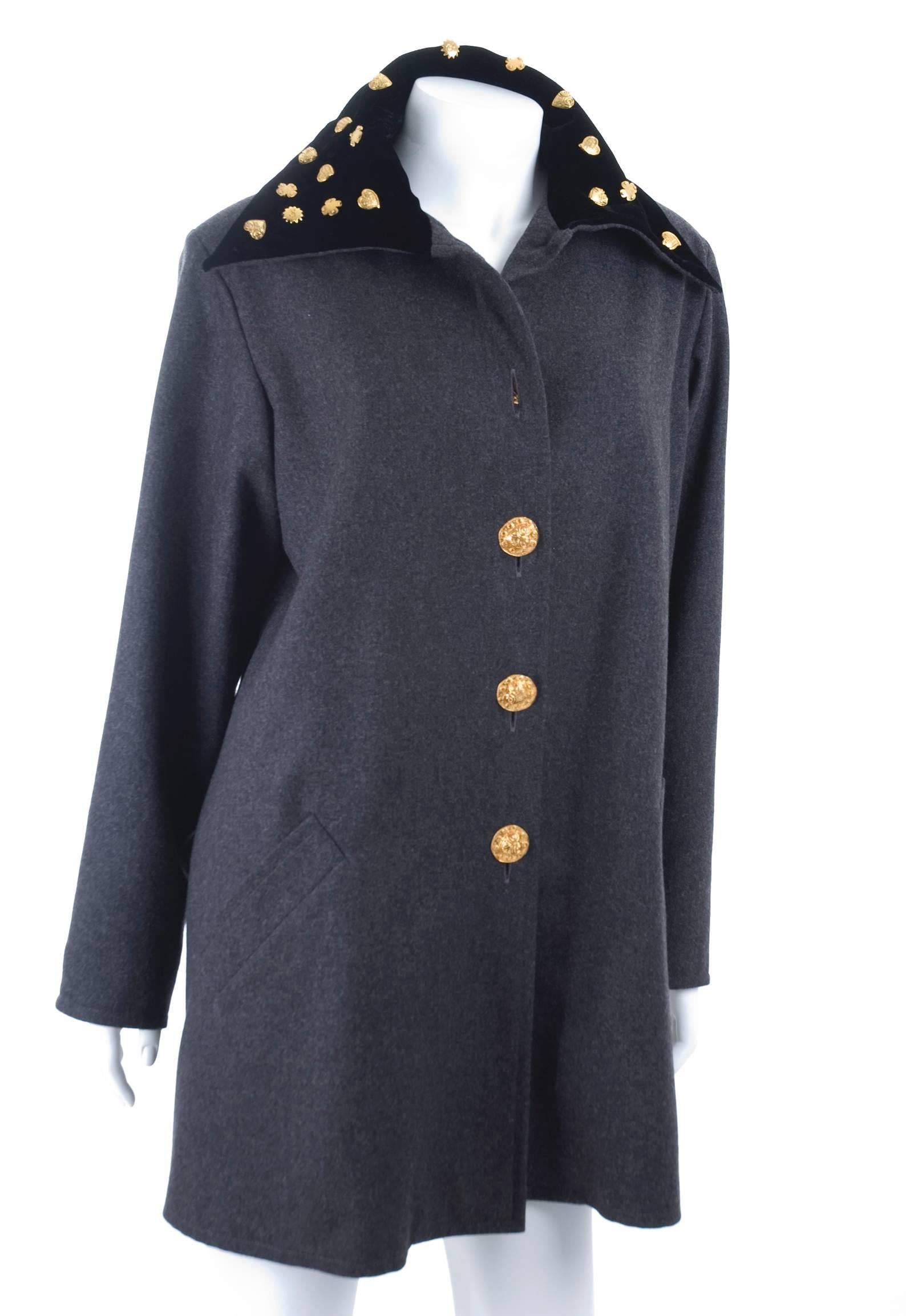 Beautiful Christian Lacroix A-Line Jacket with black velvet collar and gilded studs. Also the buttons by Lacroix always an art piece.
Grey wool light weight and lined.
Excellent condition - no flaws to mention.
Size US 10
Measurements:
Length