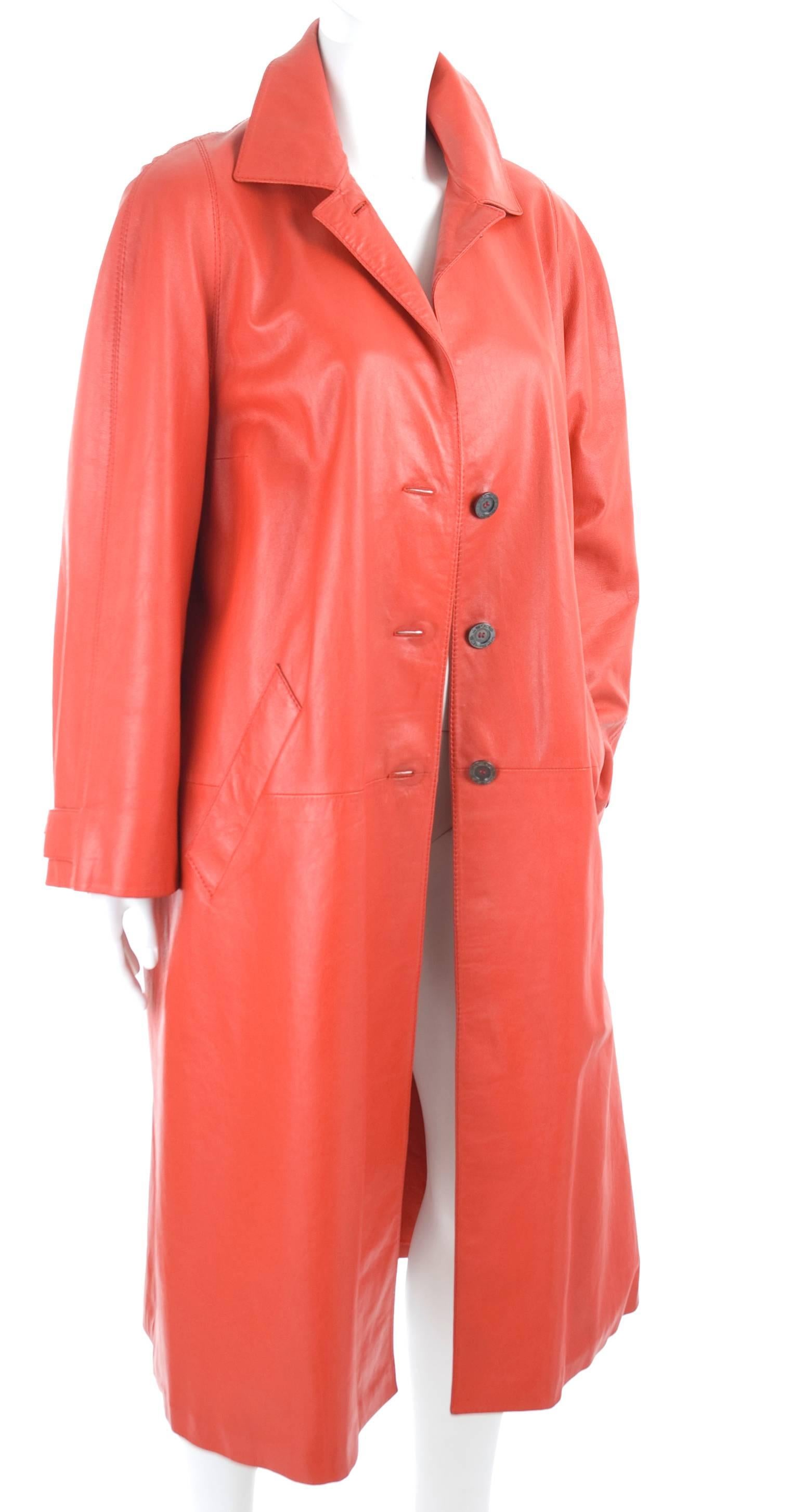 Hermes Sport Red Leather Coat.
A-line with a long slit in the back.
Size label is missing - it fits like a medium.
The condition is excellent - The buttons have left a imprint around the buttonholes, other than this is the condition