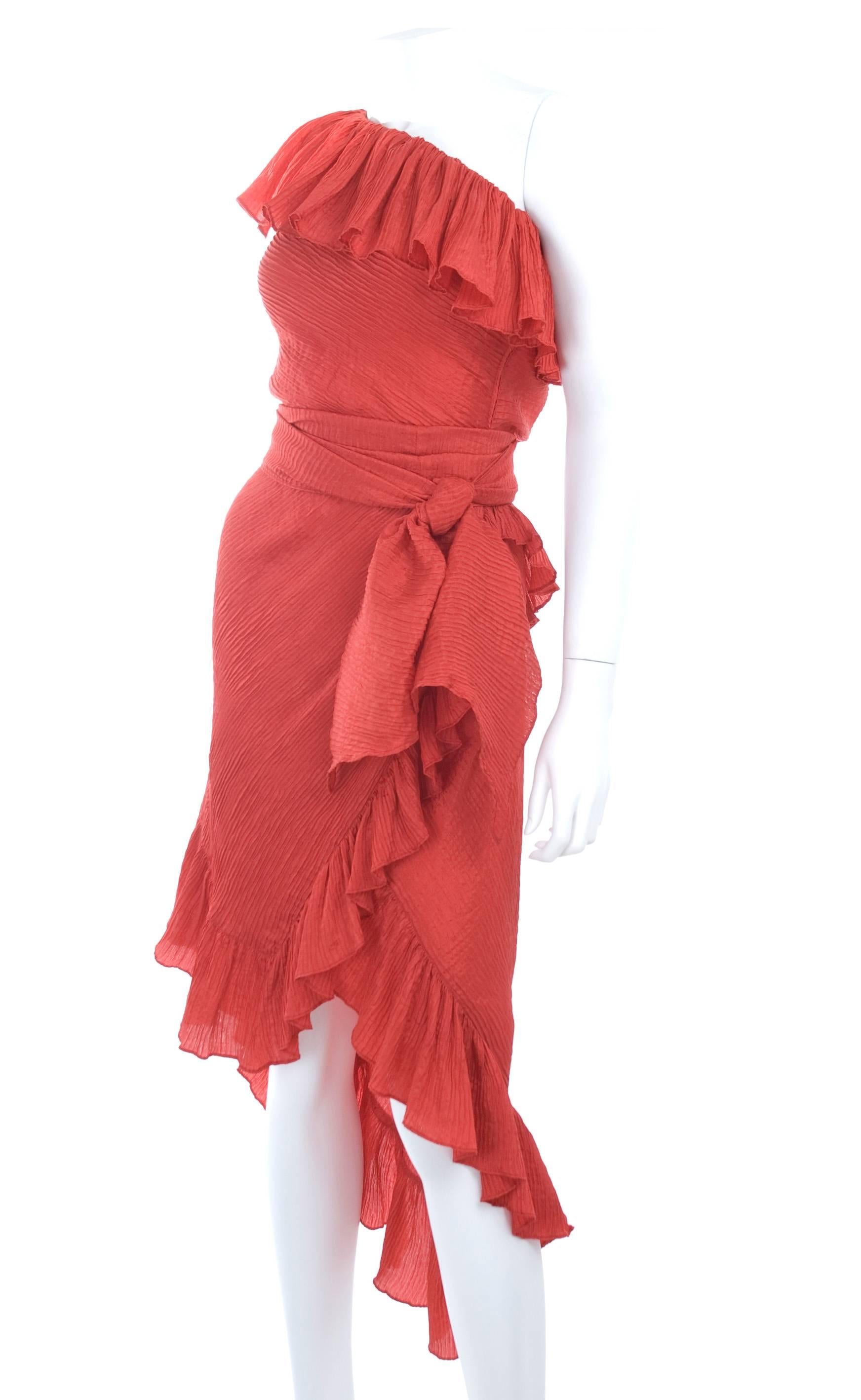 Vintage Yves Saint Laurent red cocktail dress off one shoulder and asymmetrical hemline. The scarf belt around the waist line is 8