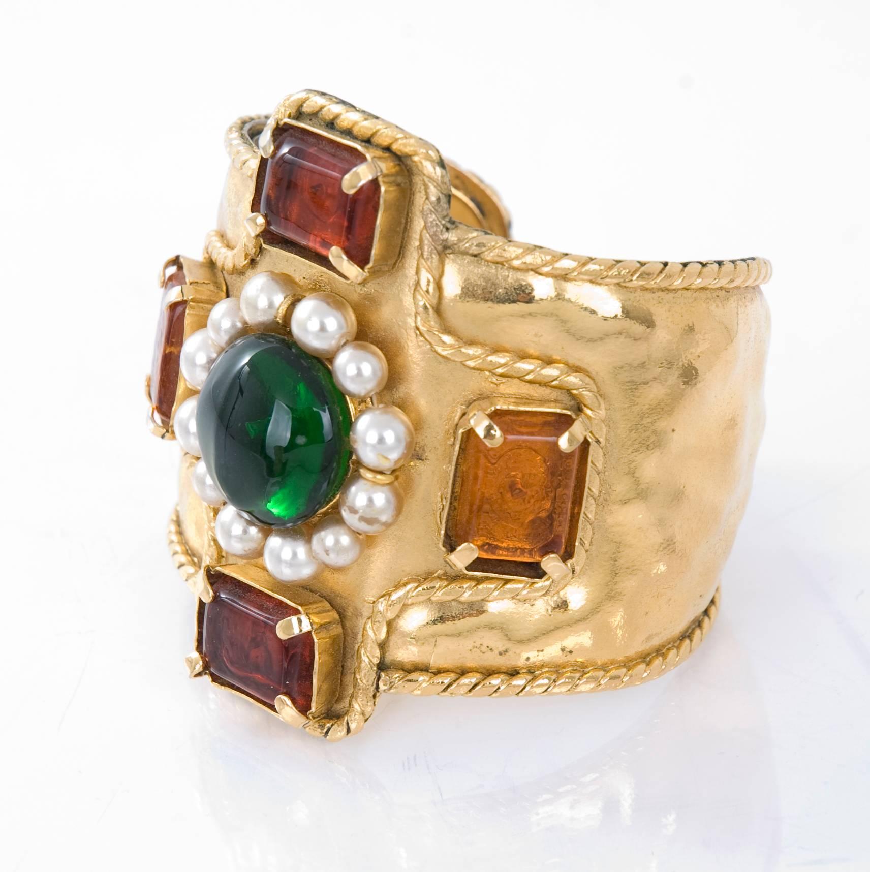 2005 Chanel cuff bracelet with pearl beads and green, gold and red gripoix stones. Stamped on Chanel cartouche at interior. 
In excellent condition.