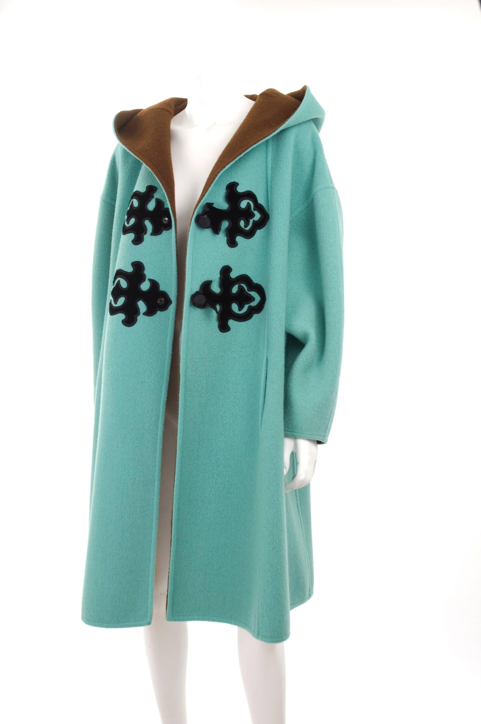 1990's Christian Lacroix Mint Green and Brown Oriental Appliqué Oversized Coat. The double face wool fabric in mint green and brown inside with black velvet oriental applications. Snap buttons closure.
Excellent condition - no flaws to