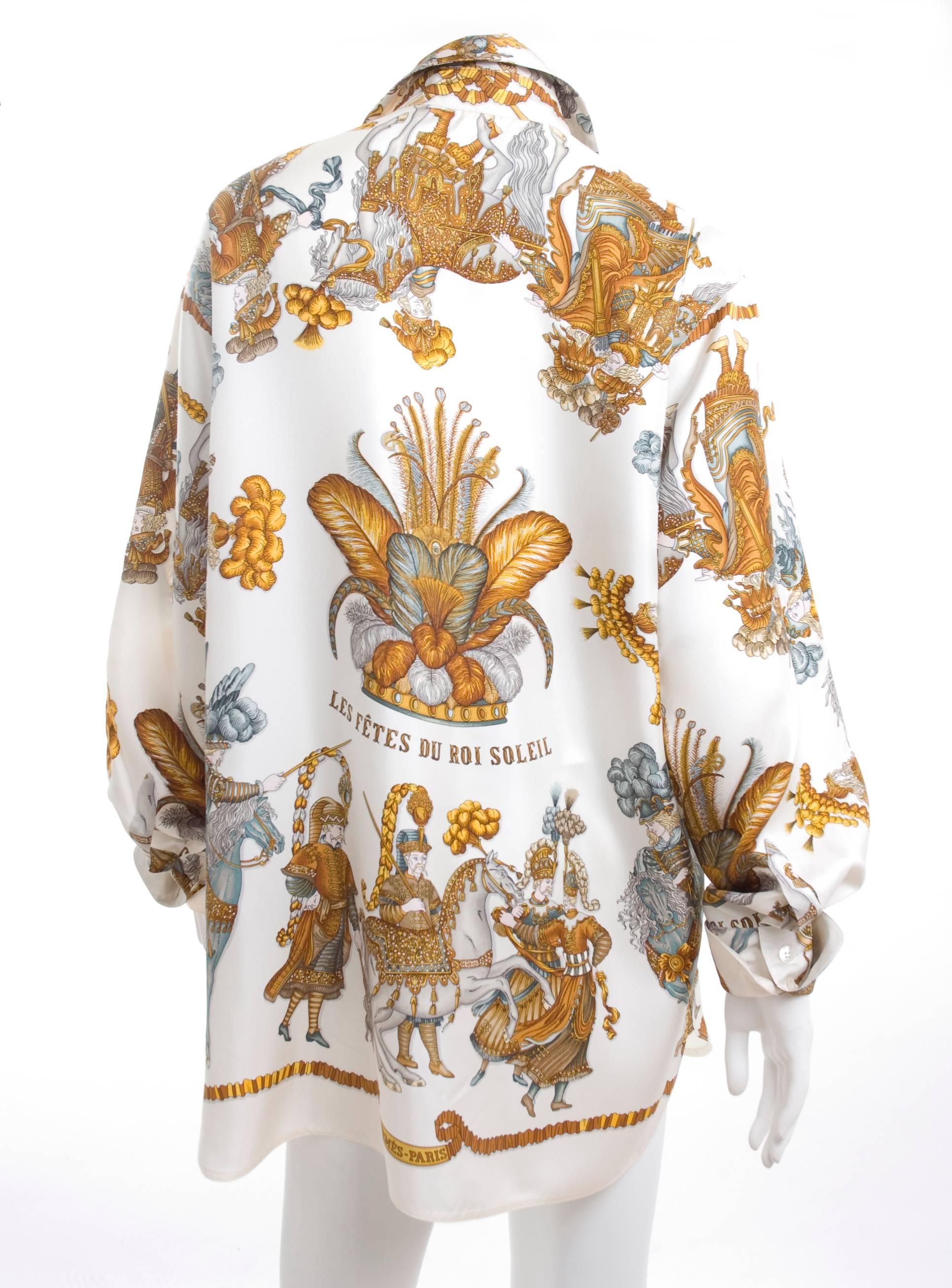 Vintage Hermes silk blouse - LES FETES DU ROI SOLEIL - motive design by Michel Duchene and first issued in 1994.
The background color is white and the print in gold, blue, grey and brown.
In excellent condition - no flaws at all to mention.
Size 46