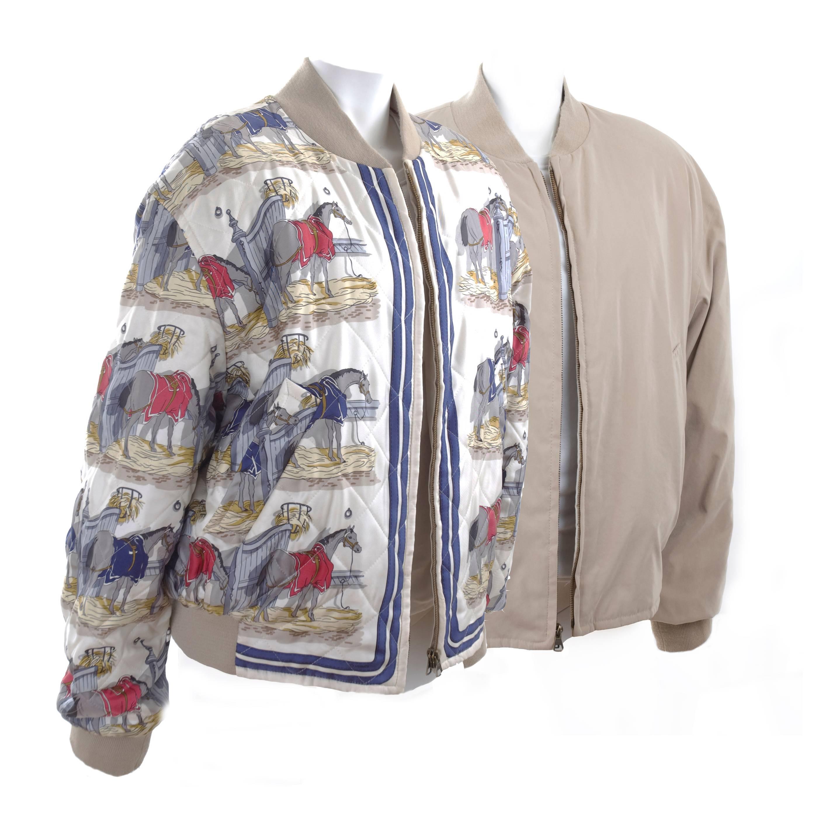 Beautiful Hermes - Ecuries - silk reversible men's jacket. The print with Equestrian horses is in creme, blue beige and some red. 
The revers side is solid beige. Size: 52 EU  
Excellent condition - just been dry cleaned. 
Measurements: Length 27 -