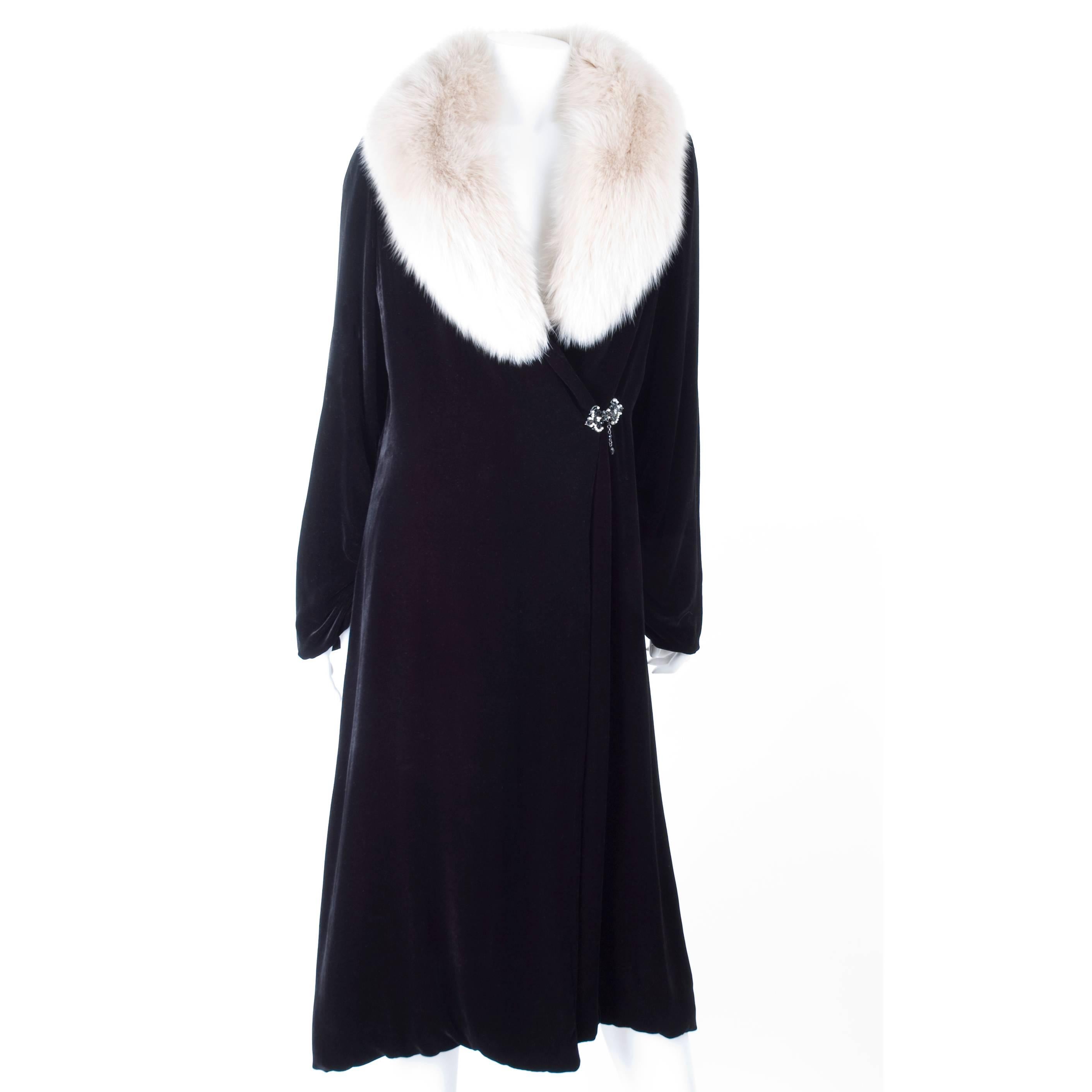 Bluemarine Velvet and Fur Evening Coat as seen on MADONNA.
Black rayon with silk velvet and fox fur collar. Beautiful brooch with hook in the waist line as the closure.
The coat is outside in excellent condition, the lining has some signs of