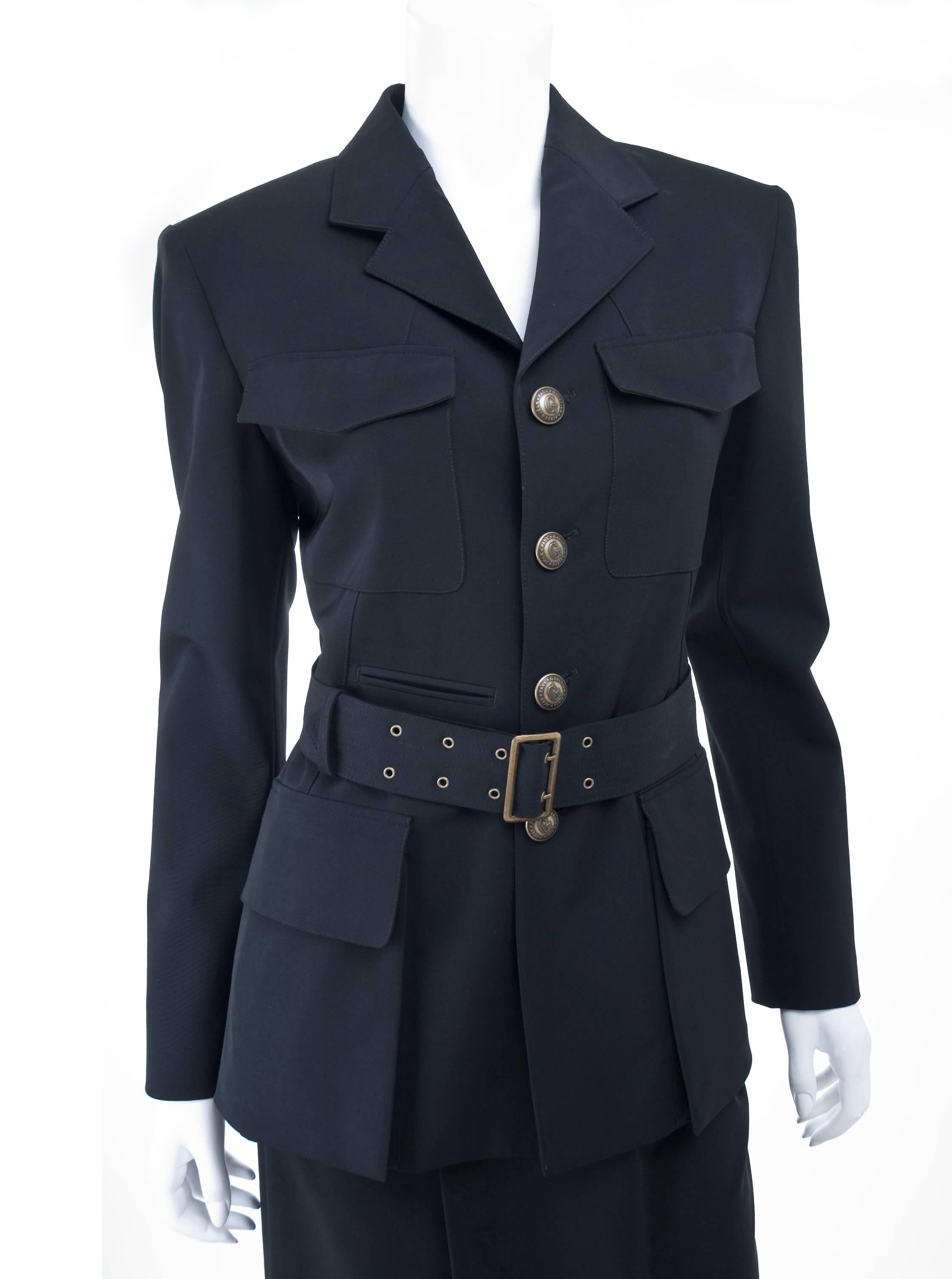 Jean Paul Gaultier Femme Suit from the 1993/94 Collection.
The skirt is a faux wrap, closure with zipper in the pleat and hook.
The Jacket is single buttoned and can be worn with the belt.
Excellent condition.
Size US 10 - 44 IT
Measurements:
Skirt