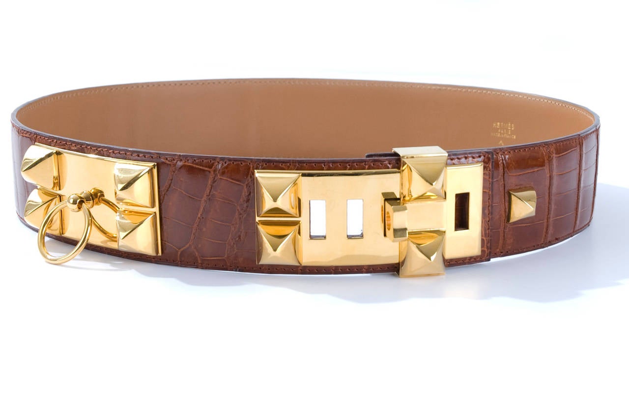 Brown Hermès Collier de Chien crocodile skin belt with gold-tone hardware and bar insert closure at front. Stamped Circle X from 1994.
Excellent condition.
Size 74 - length 33.5 inches - 85.5 cm
width 1.75