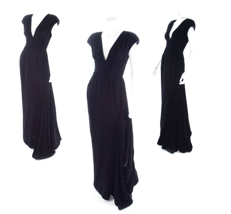 1980 Valentino black velvet evening dress with side train.
Train with finger loop to lift it of the floor.
Excellent condition. 
Size label missing- about US 6
Measurements: 
Length 61