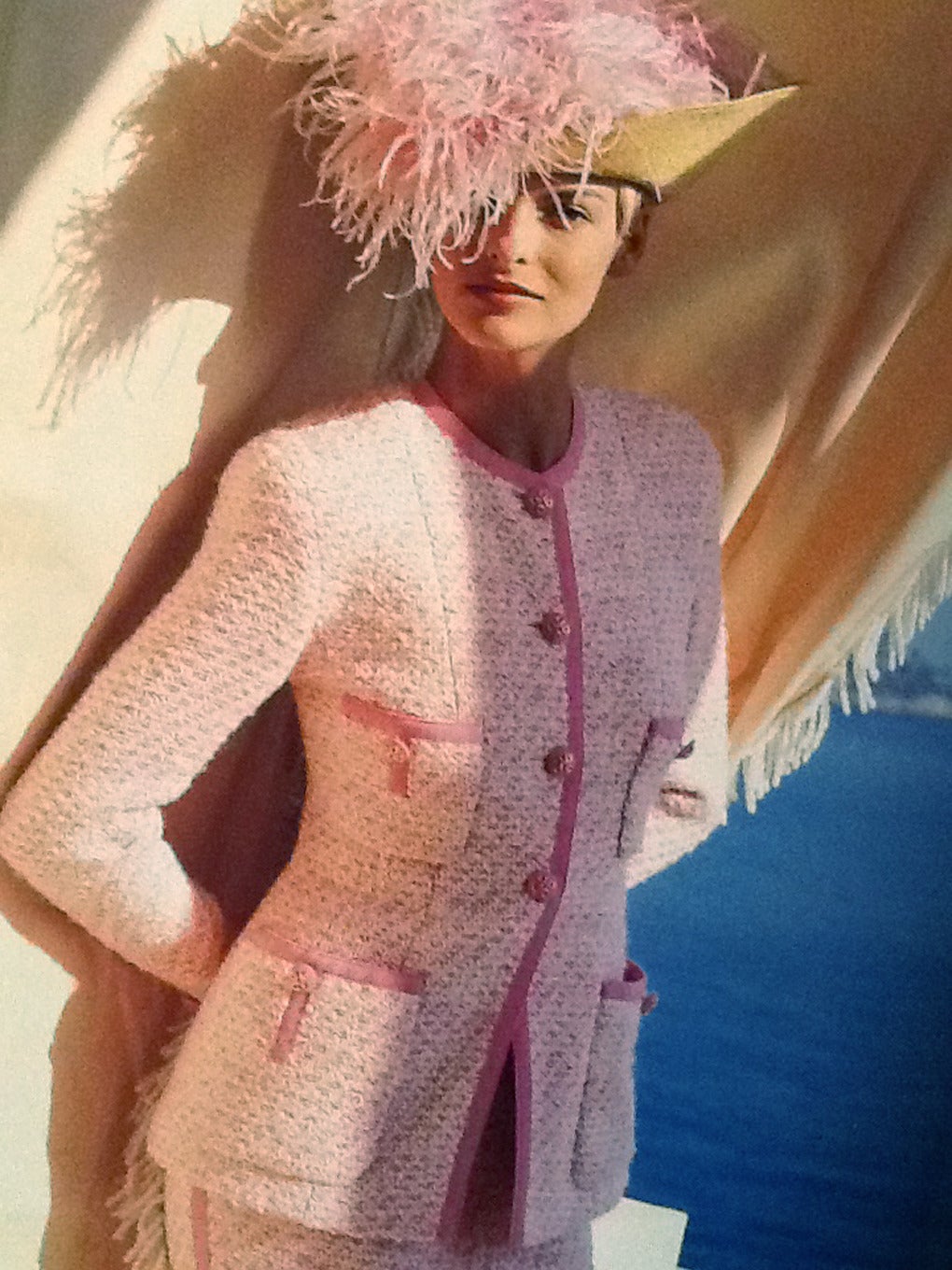 Chanel suit in pink and creme . 
Documented with Chanel catalogue picture.
Size EU 38
Measurements:
Jacket: Length 27