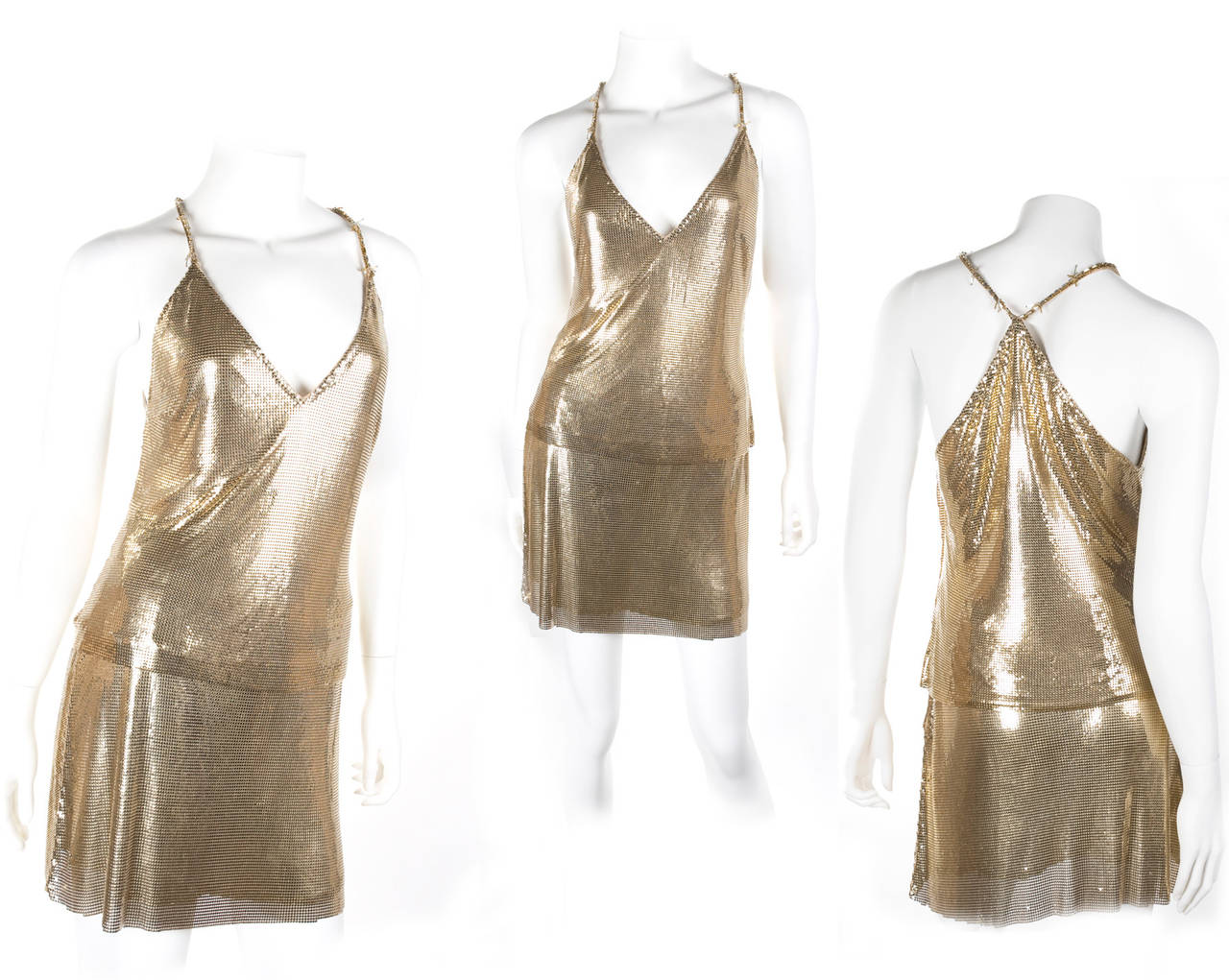 1982 Gianni Versace Couture Metal Mesh Oroton Top and Skirt.
Gold metal drapes fluidly and softly around the body.
Size EU 40
Measurements:
Top length 56 cm - 22” inches – Bust 86 cm - 34” inches
Skirt: 40.5 cm - length 16” inches  - Waist 71