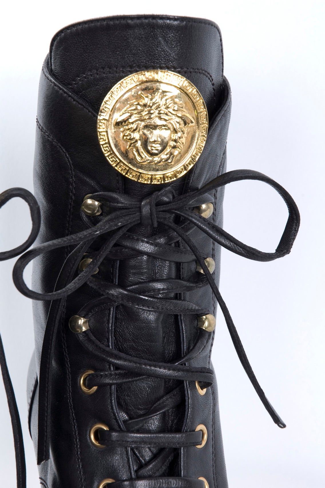 Vintage Gianni Versace black lace-up leather boots with large gilded Medusa.
From ca. 1980 
Worn once for a few hours - Excellent Condition.
Size 39.5 EU - 9.5 US