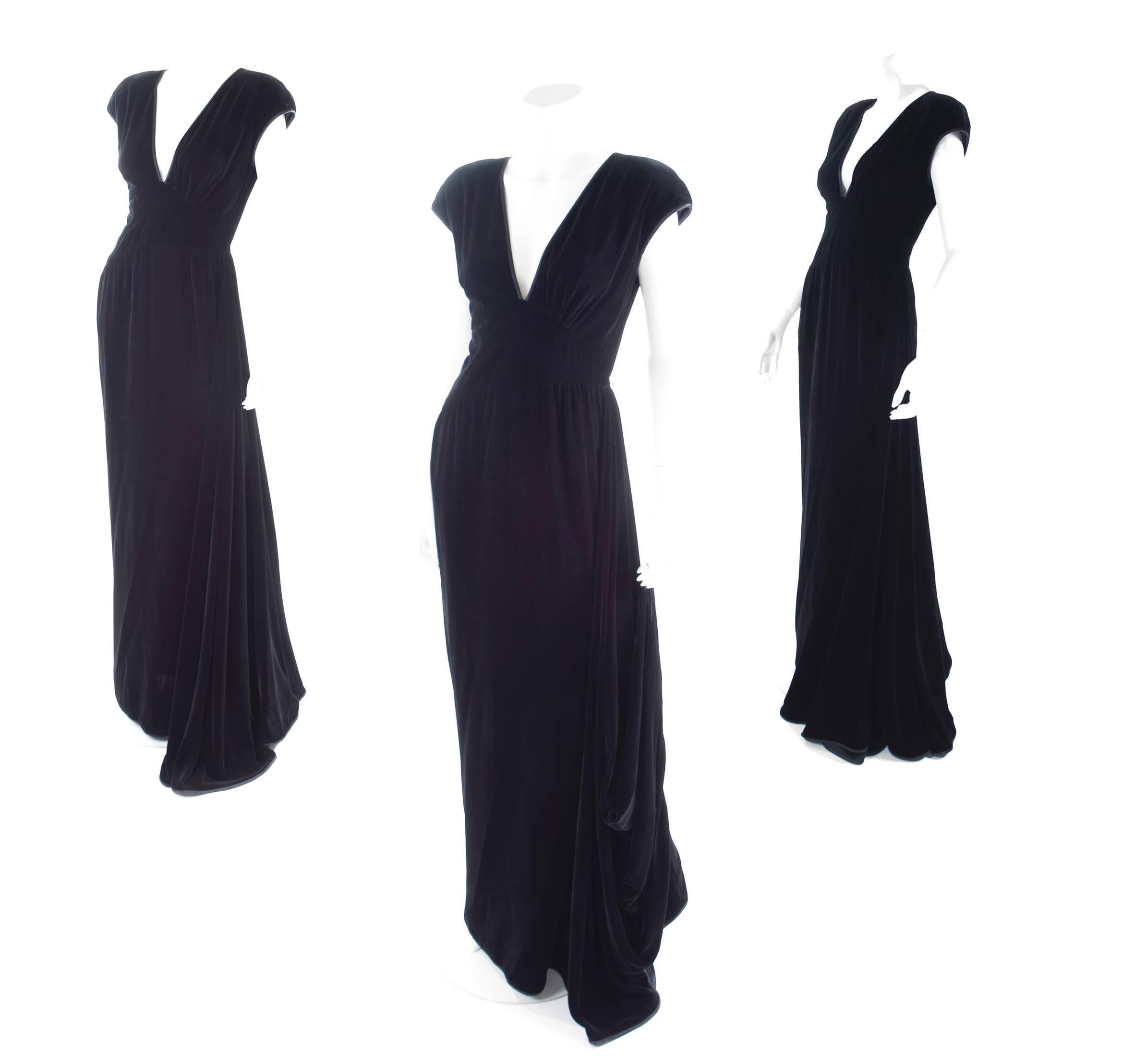 1980 Valentino black velvet evening dress with side train.
Train with finger loop to lift it of the floor.
Excellent condition. 
Size label missing- about US 6
Measurements: 
Length 61 - bust 34 - waist 26- hips 36 inches