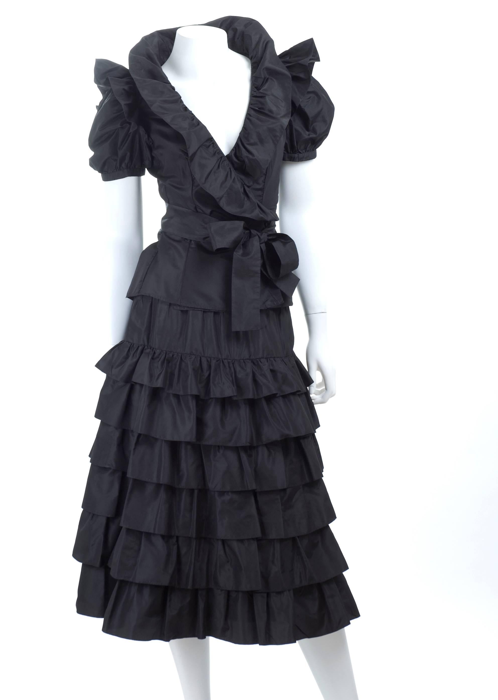 Vintage 1980s Yves Saint Laurent 2pc. taffeta dress in black. Wrap top with ruffles and tiered skirt.
Excellent condition
Size EU 38
Measurement:
Top length 21 - bust 34 inches
Skirt length 30 - waist 25 inches 